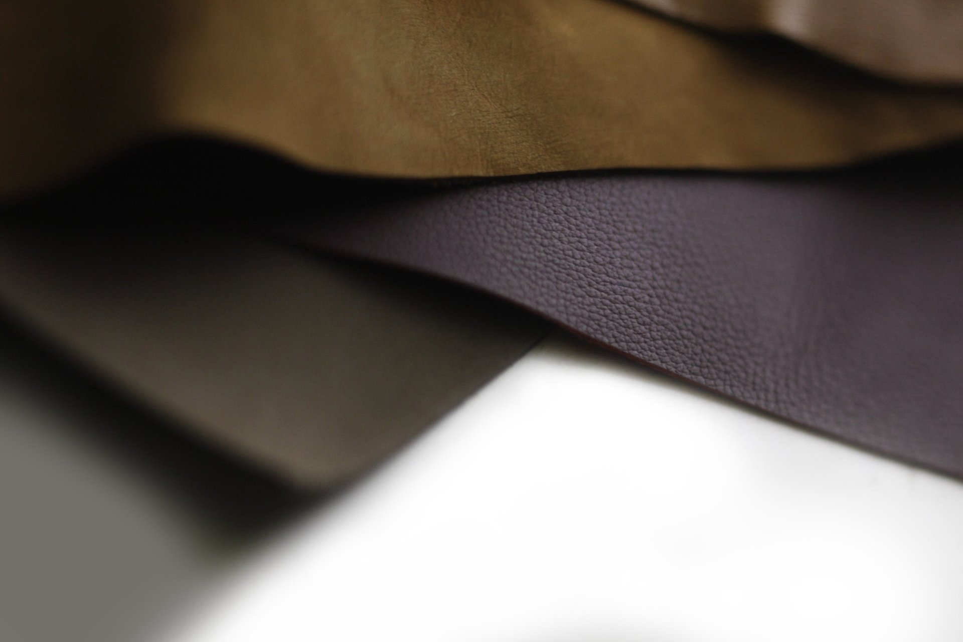 black and brown leather padded tub sofa