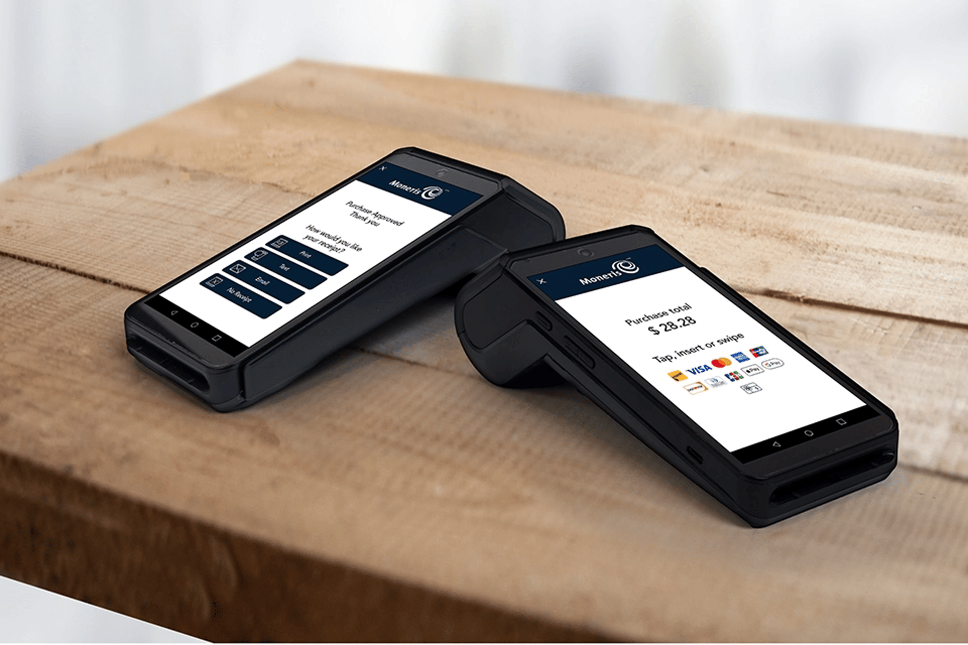 woman standing and holding smartphones