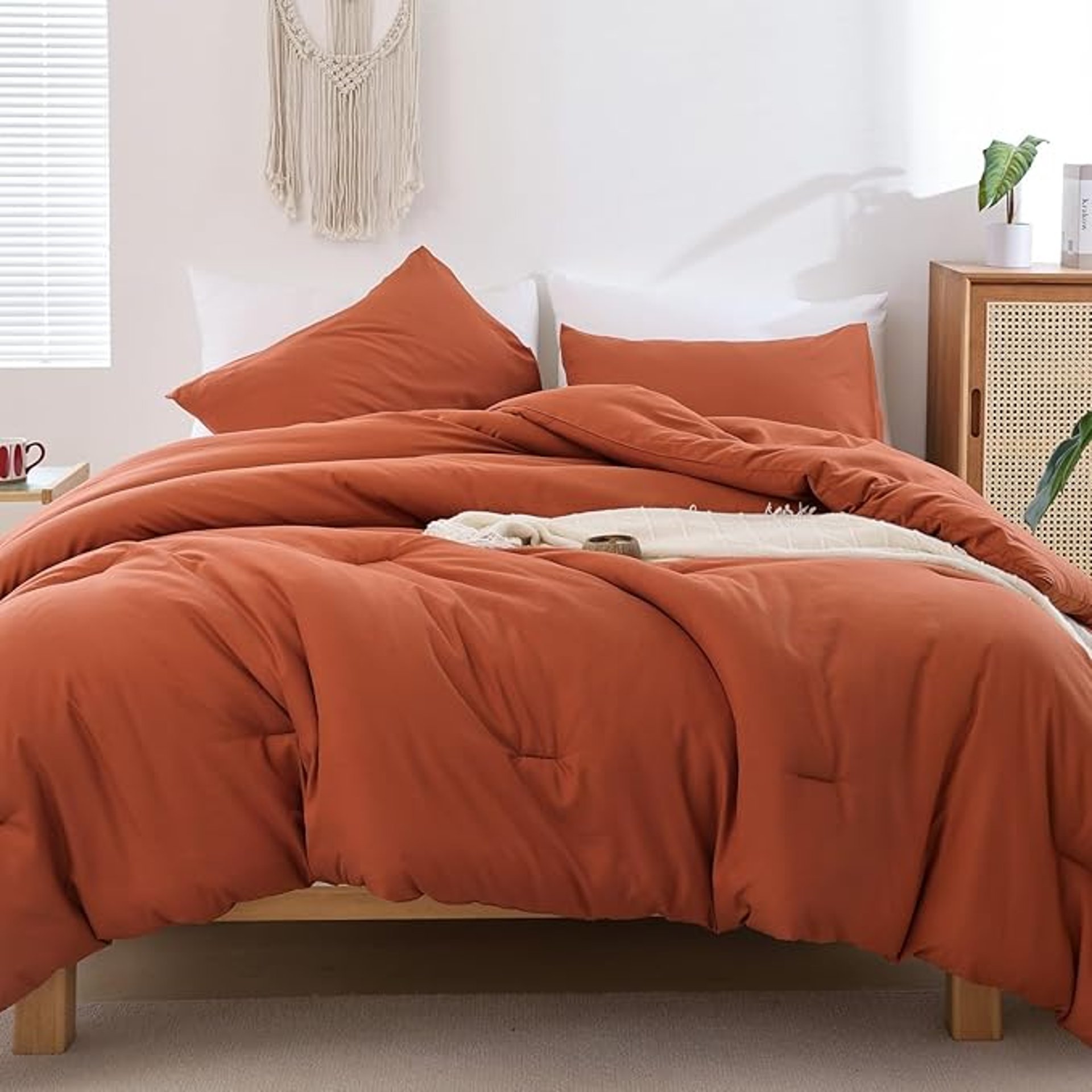 white bed with gray and white bed linen