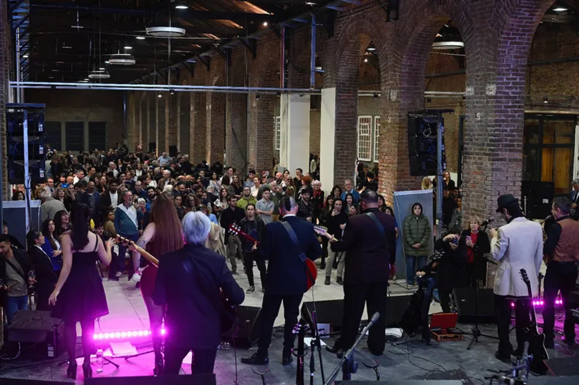 an abstract photo of a curved building with a blue sky in the background