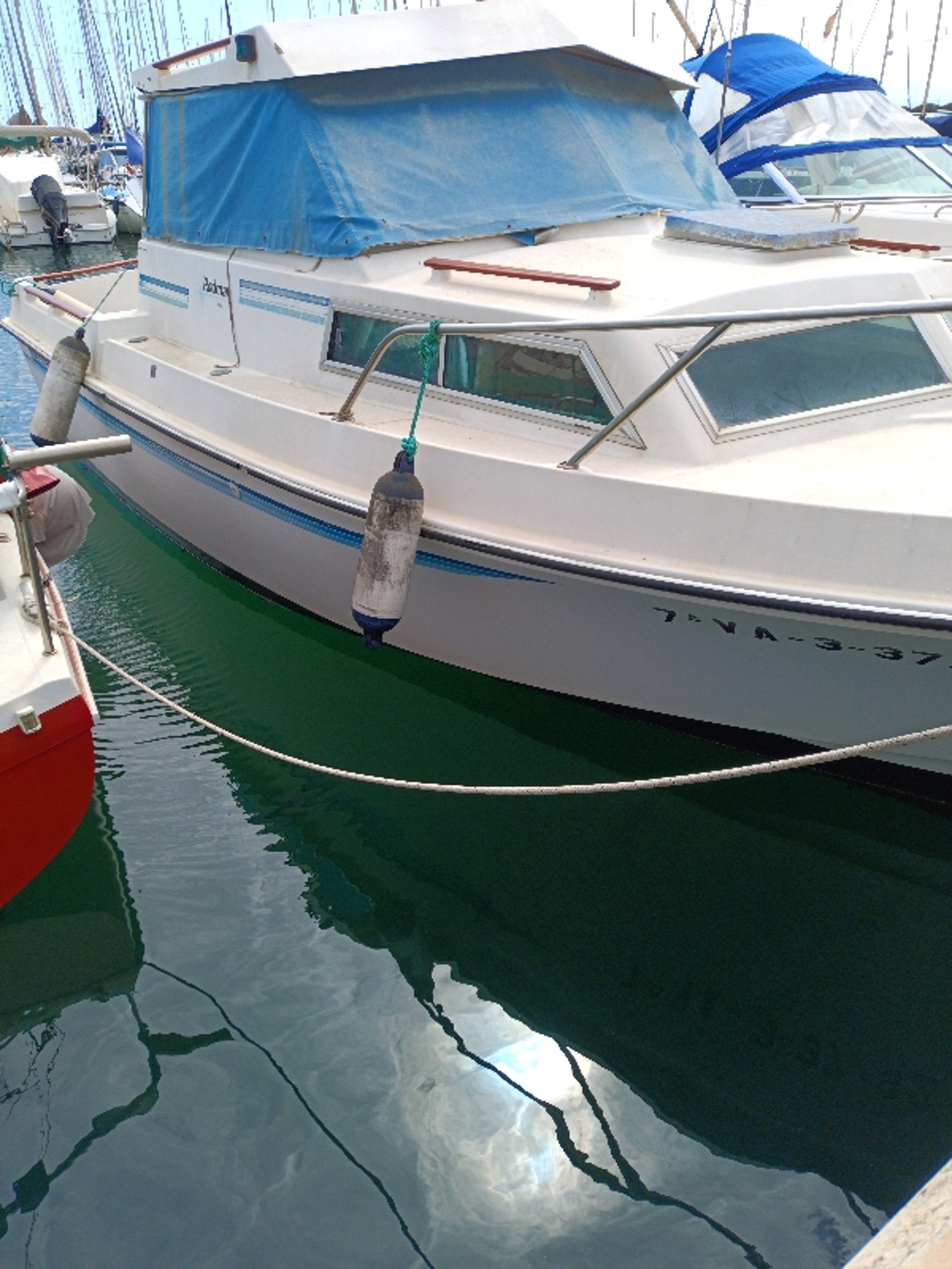 an abstract photo of a curved building with a blue sky in the background