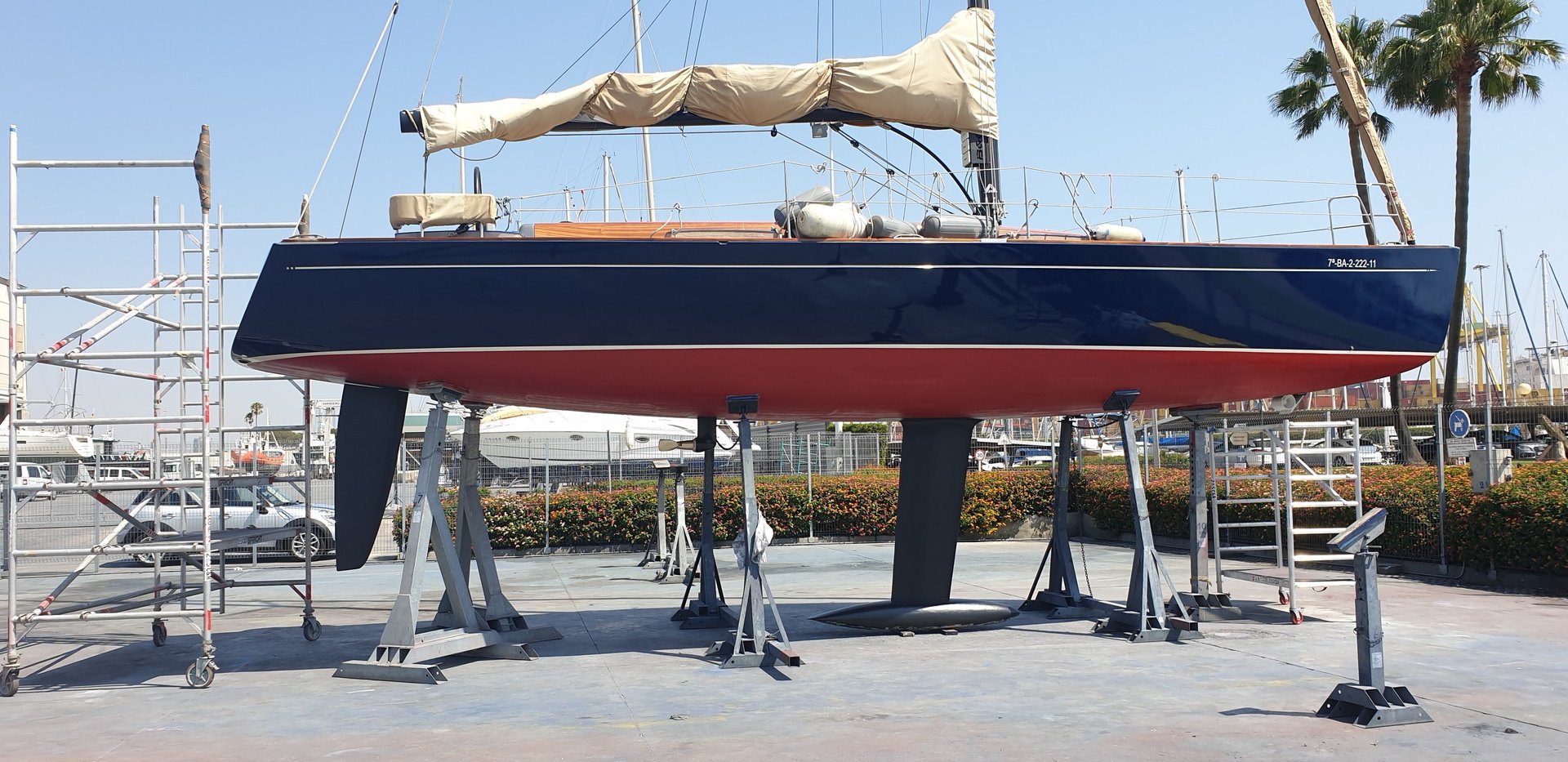 three sail boats on water during daytime