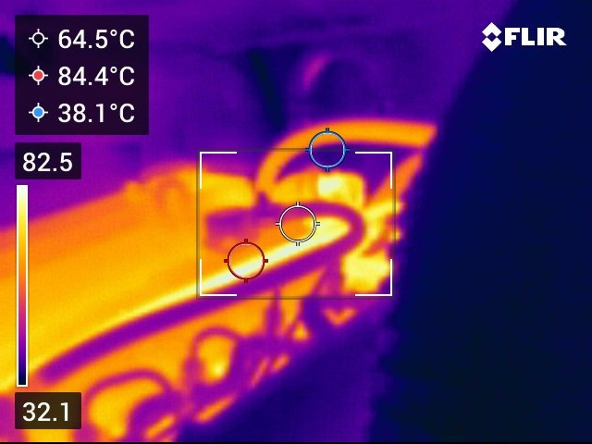 an abstract photo of a curved building with a blue sky in the background