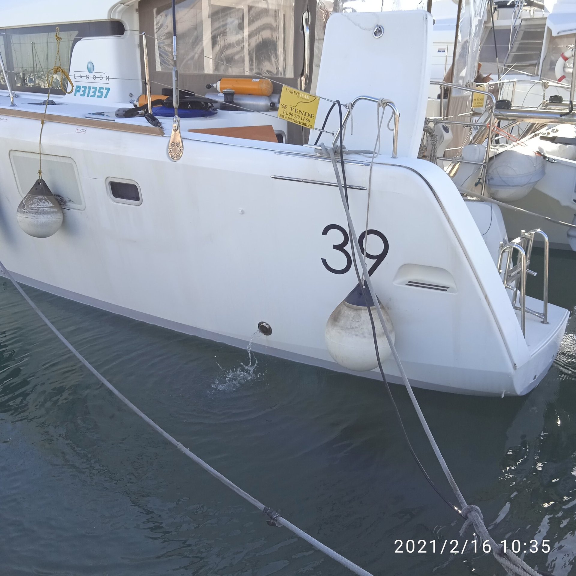 three sail boats on water during daytime