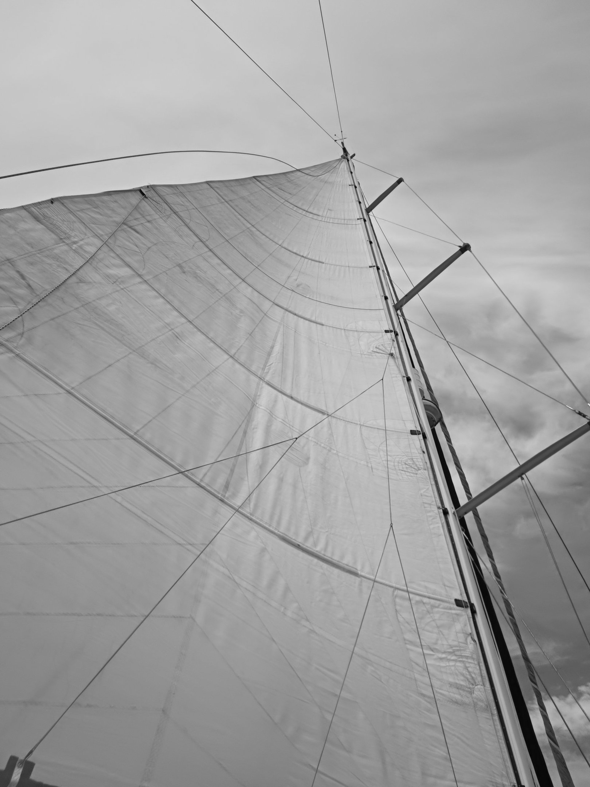 an abstract photo of a curved building with a blue sky in the background