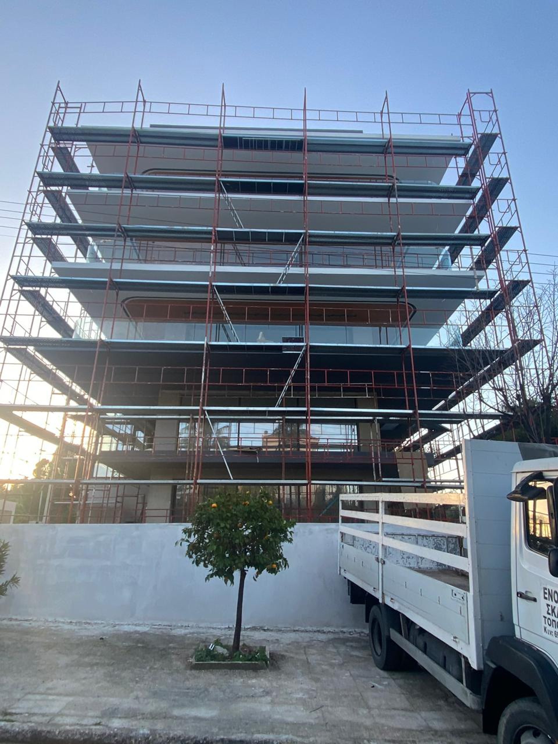 woman wearing yellow long-sleeved dress under white clouds and blue sky during daytime