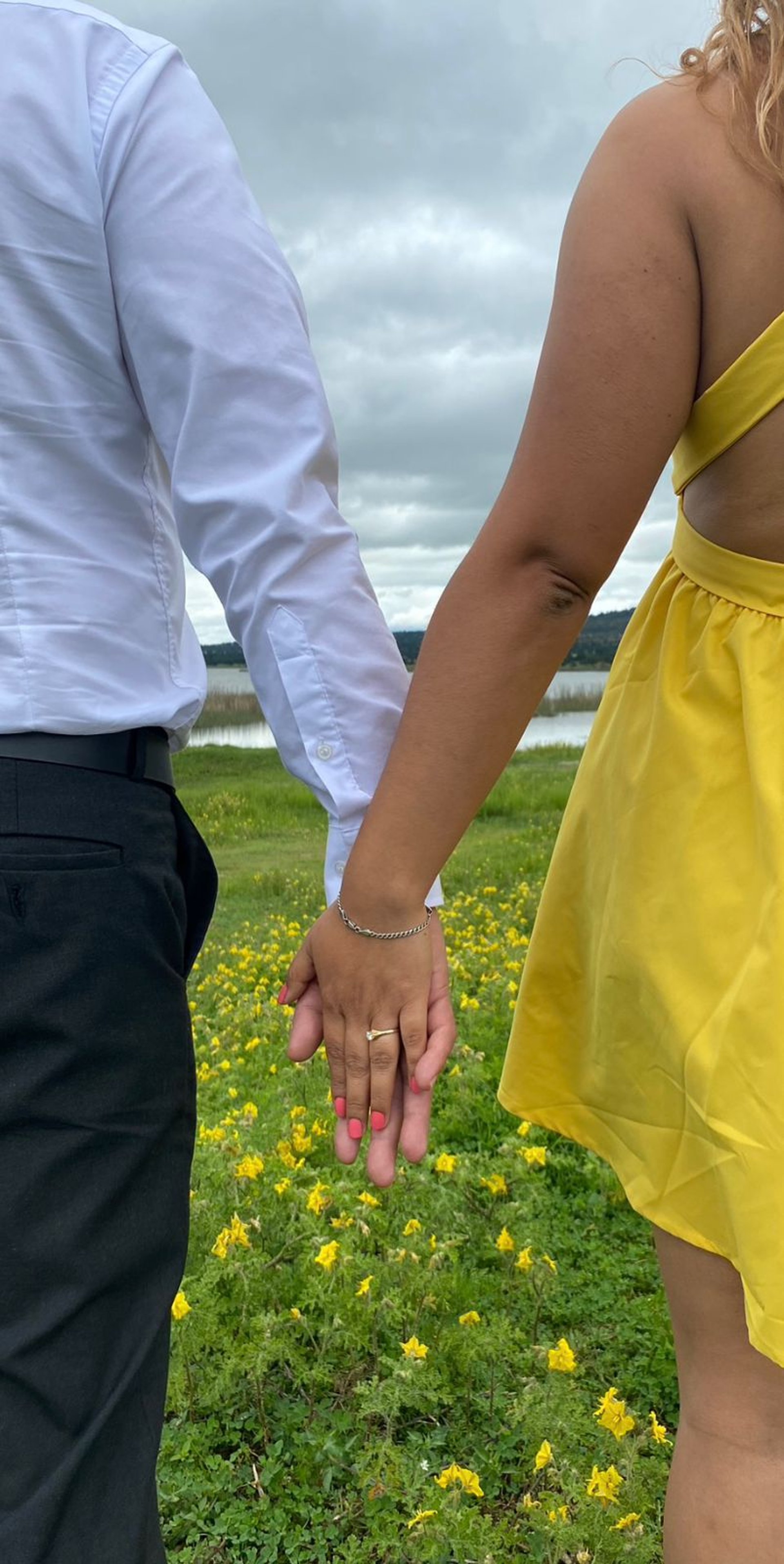 couple wearing silver-colored rings