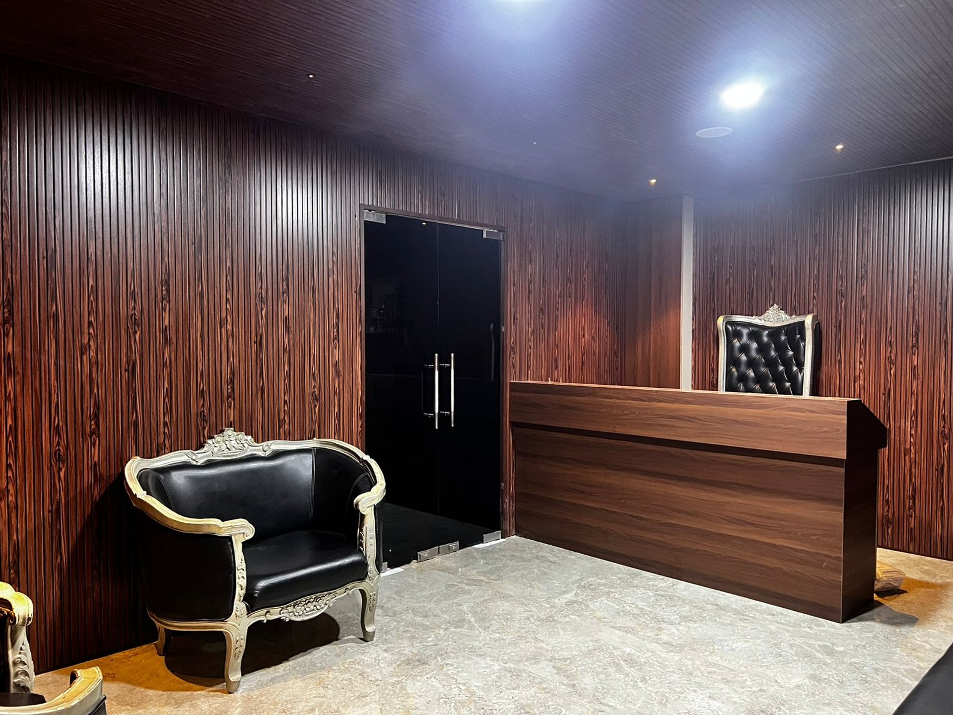 black and brown leather padded tub sofa