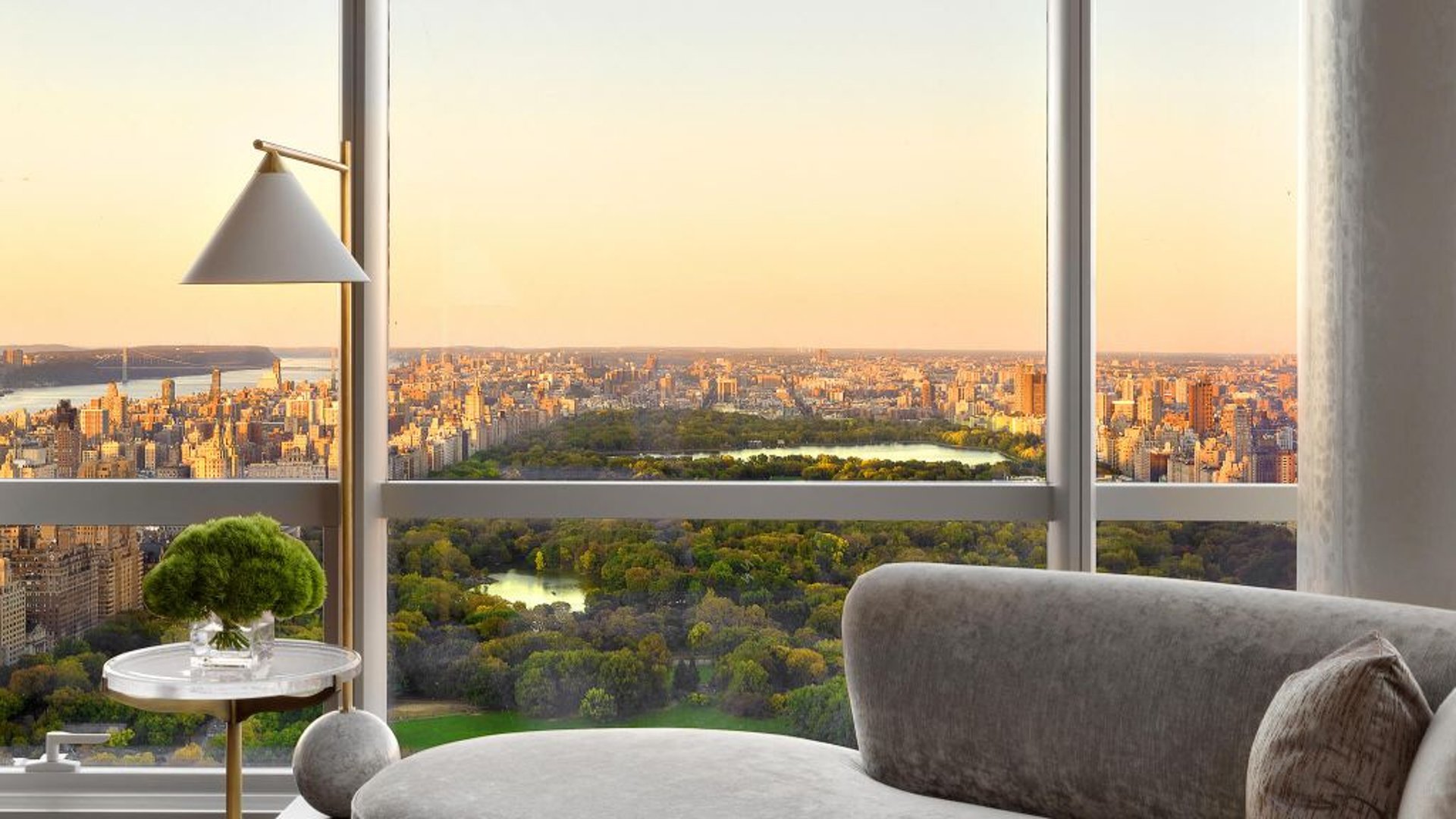 brown wooden lounge chair beside swimming pool during daytime