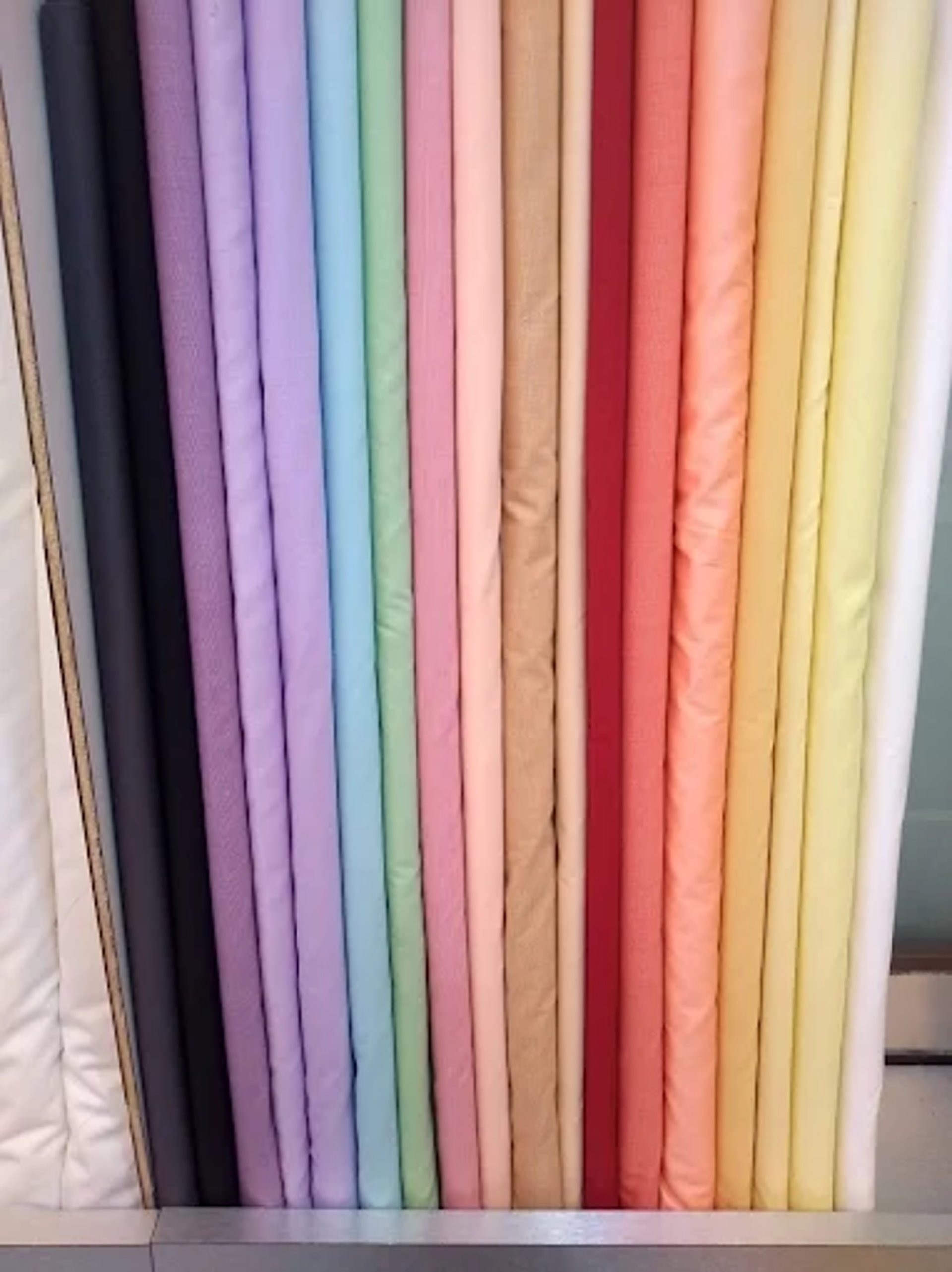 an abstract photo of a curved building with a blue sky in the background