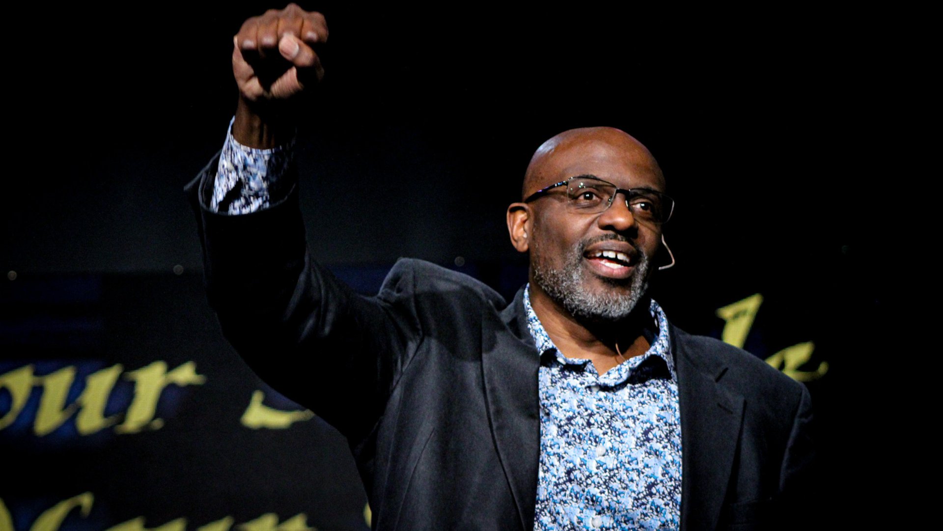 a microphone sitting on top of a desk next to a computer
