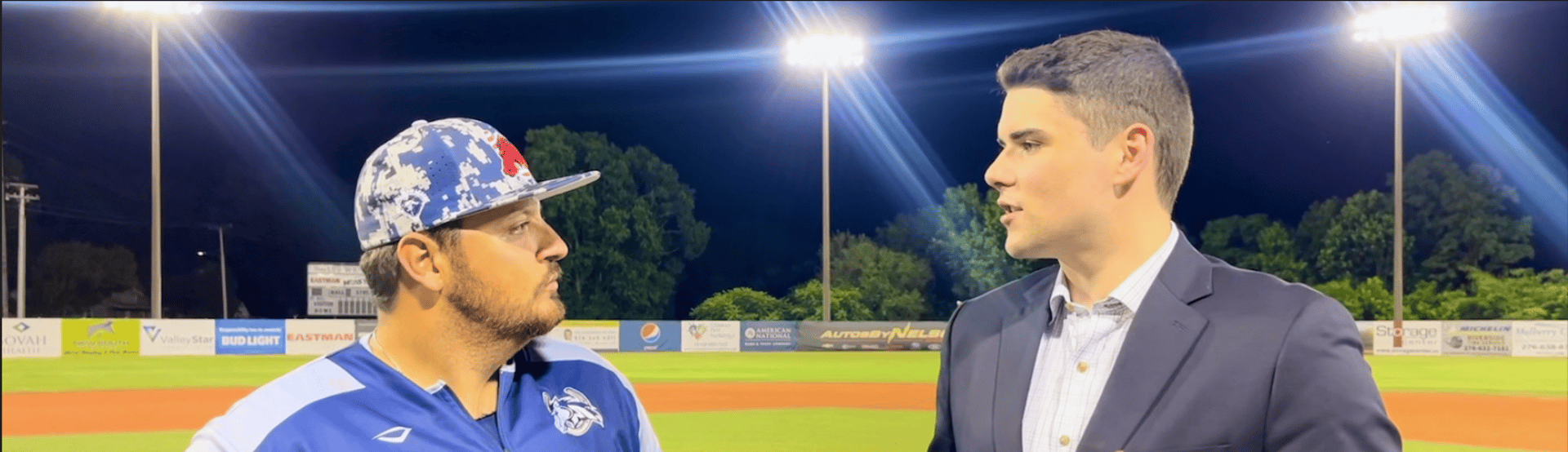 Broadcaster wearing headset with sunset in the background