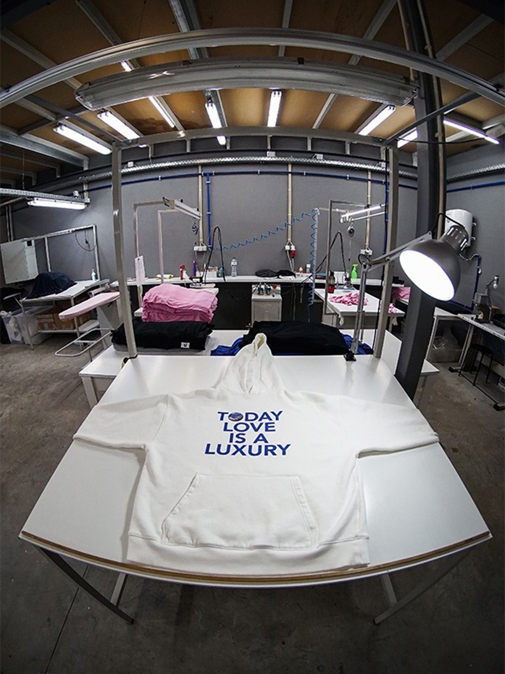 person in gray shirt sewing