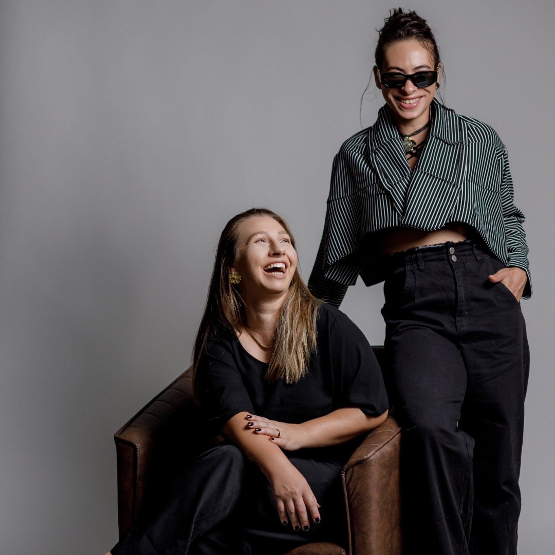 black and brown leather padded tub sofa