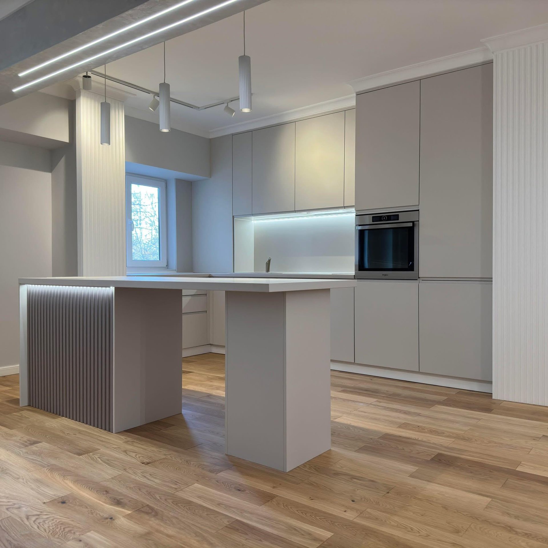 an abstract photo of a curved building with a blue sky in the background