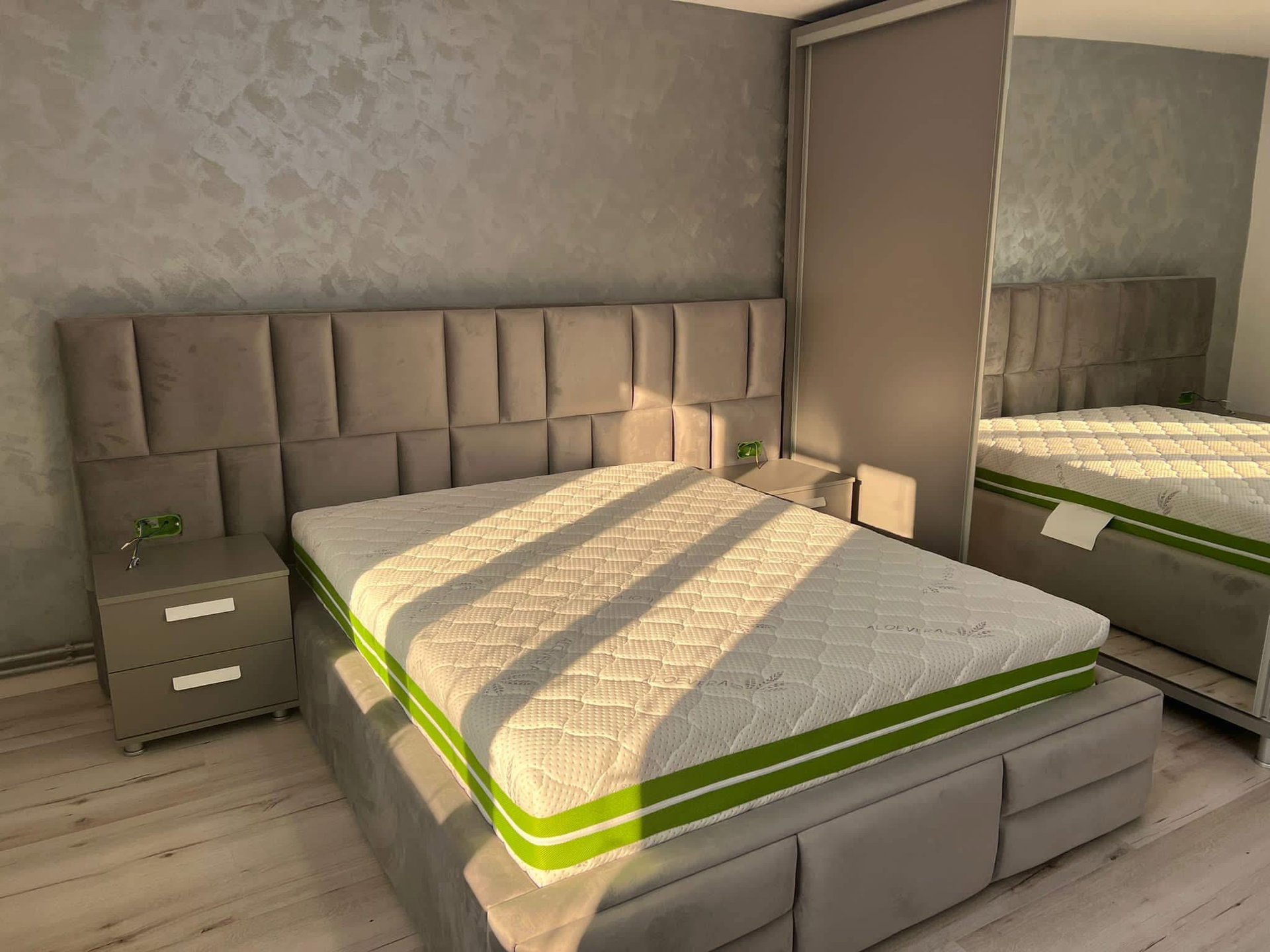 an abstract photo of a curved building with a blue sky in the background