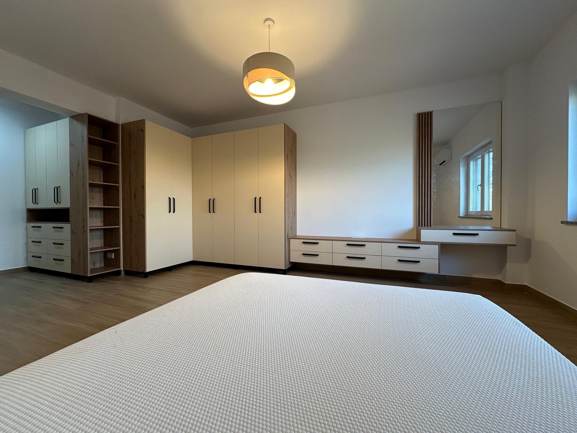 an abstract photo of a curved building with a blue sky in the background