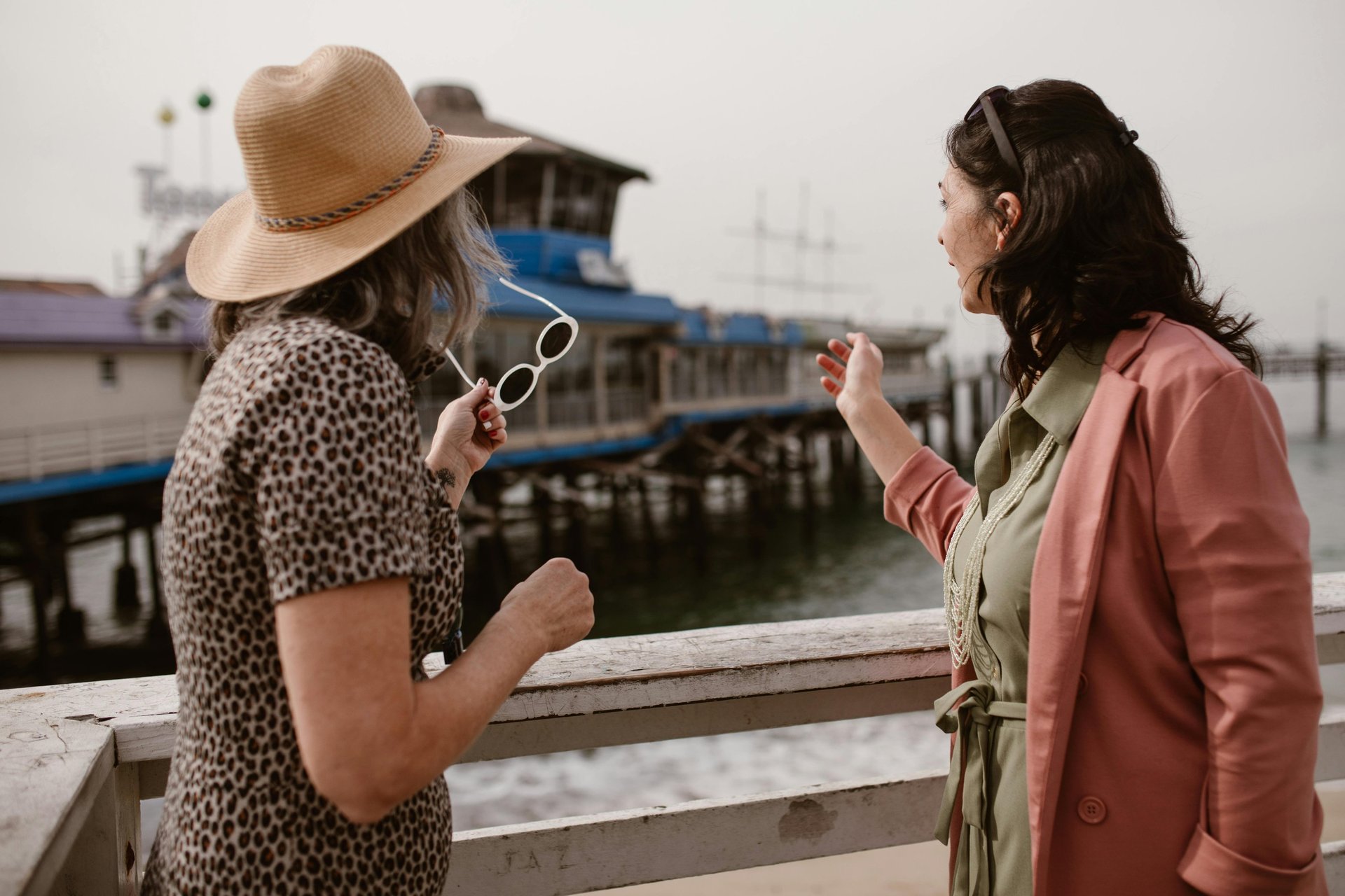 two women taking a picture with a cell phone