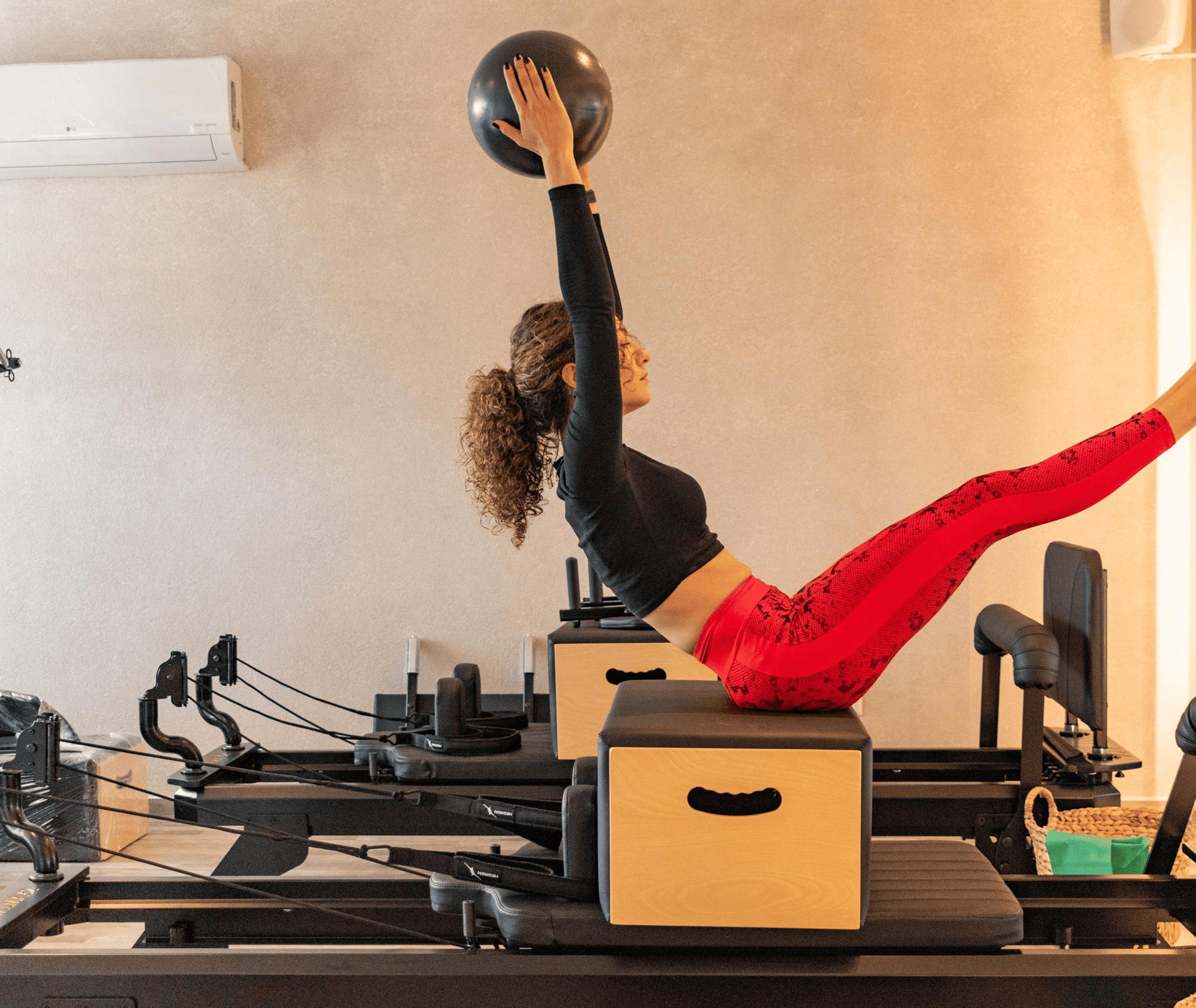 a woman is doing a plank exercise in a gym