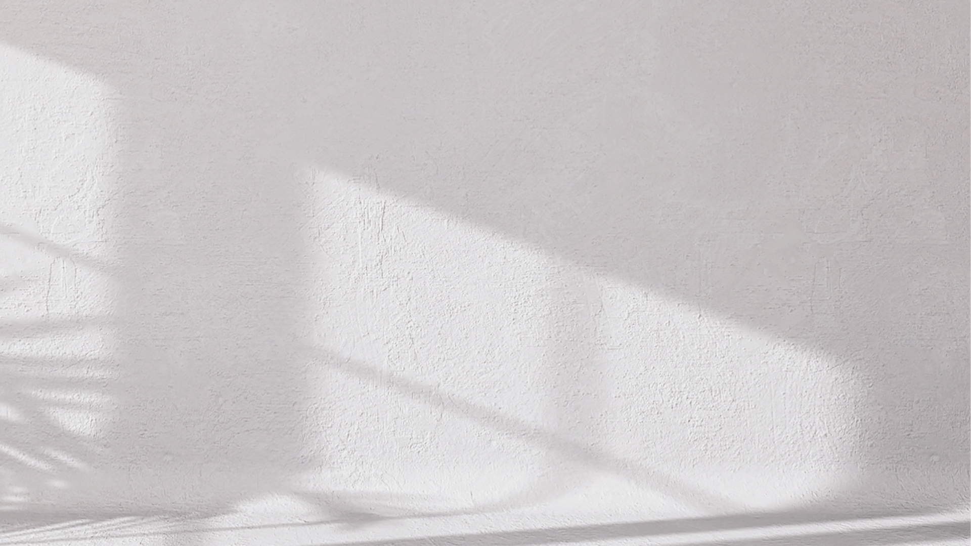 a black and white photo of a white tiled wall