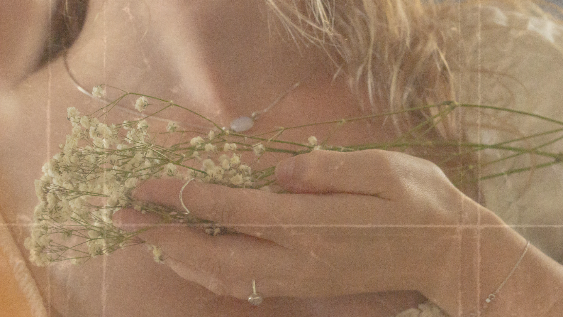 woman holding dried flower