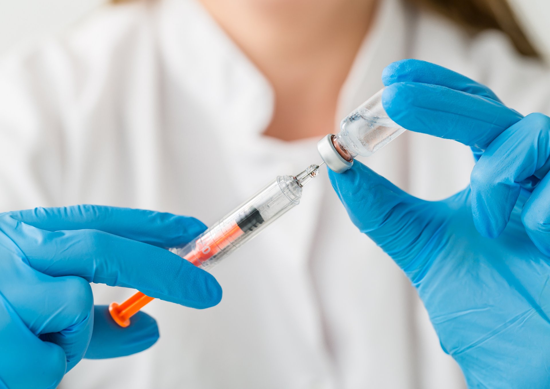 woman wearing yellow long-sleeved dress under white clouds and blue sky during daytime