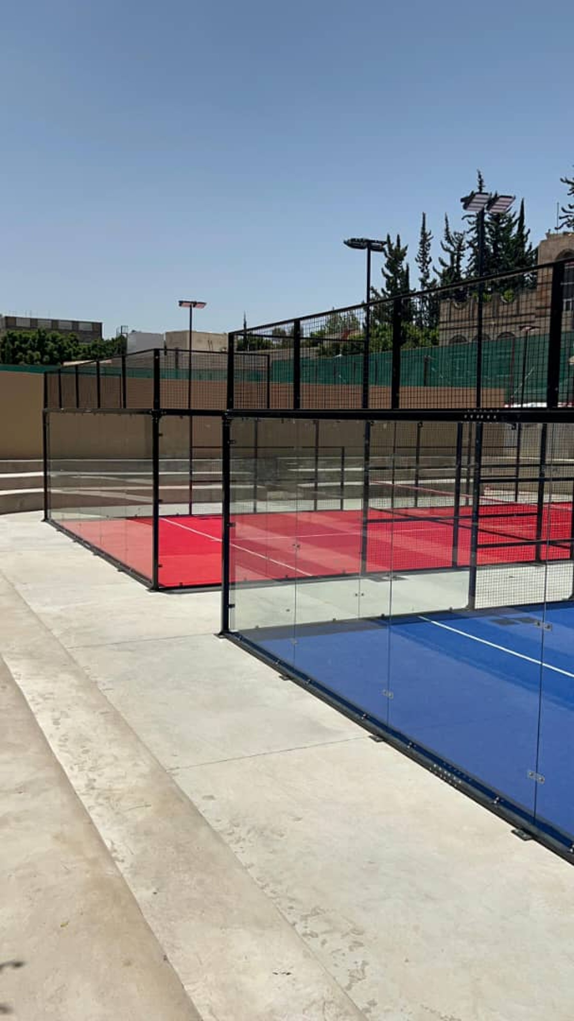 a tennis racket on a blue tennis court