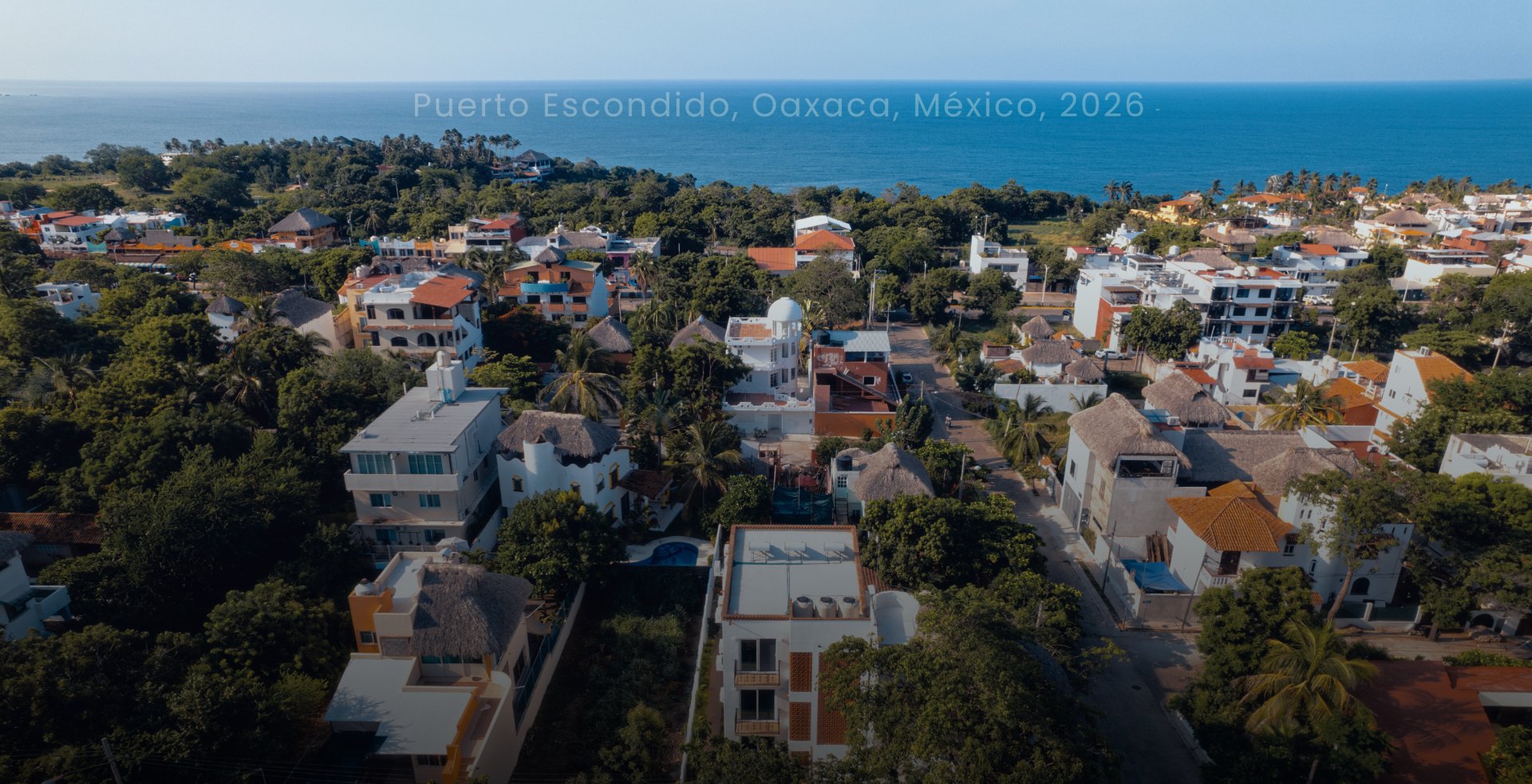 an abstract photo of a curved building with a blue sky in the background