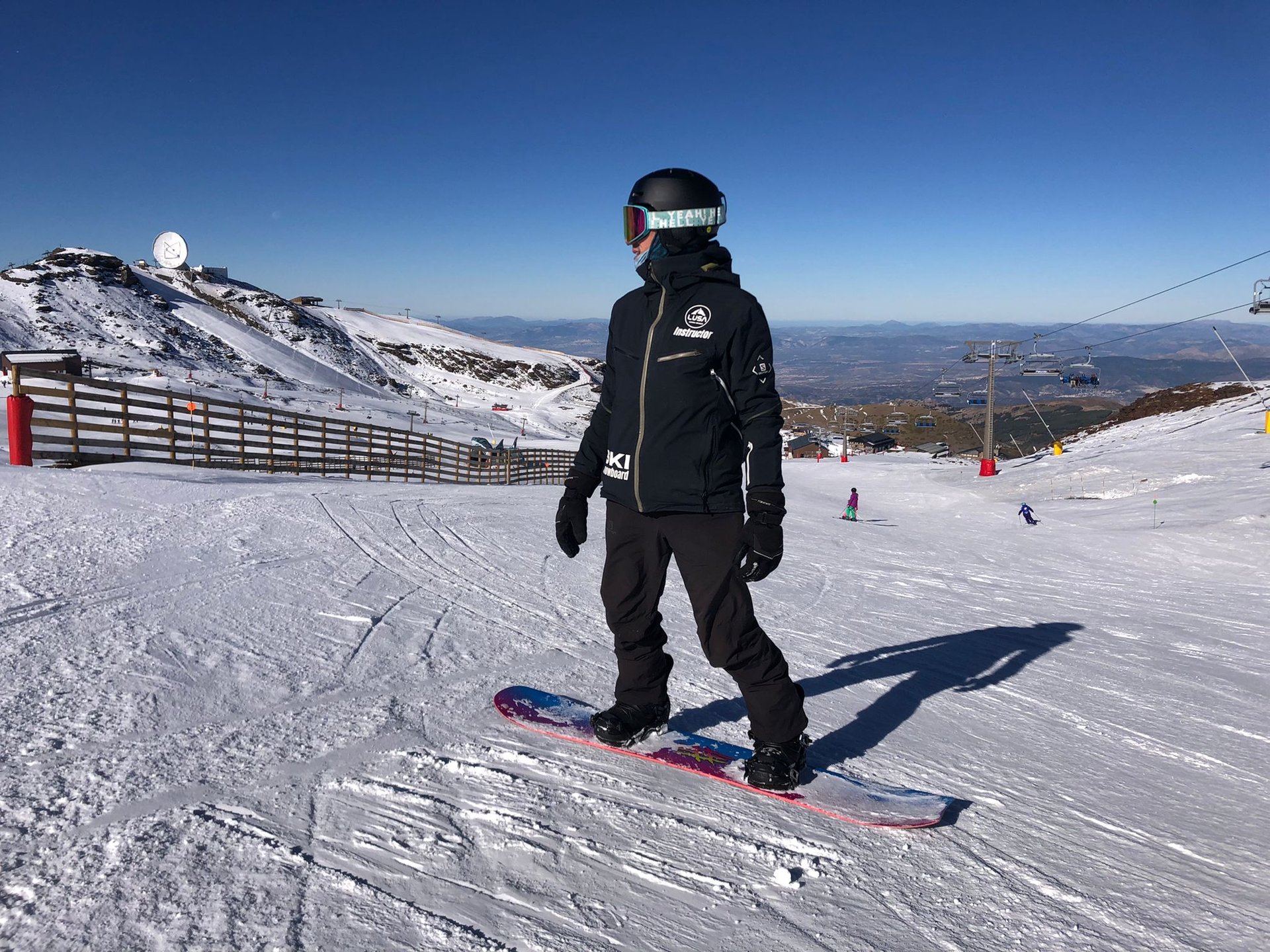 an abstract photo of a curved building with a blue sky in the background