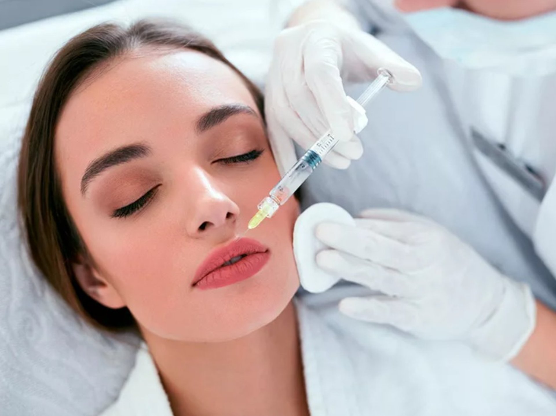 A woman getting her teeth checked by a dentist