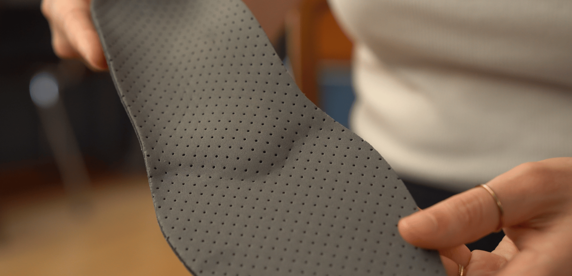 an abstract photo of a curved building with a blue sky in the background