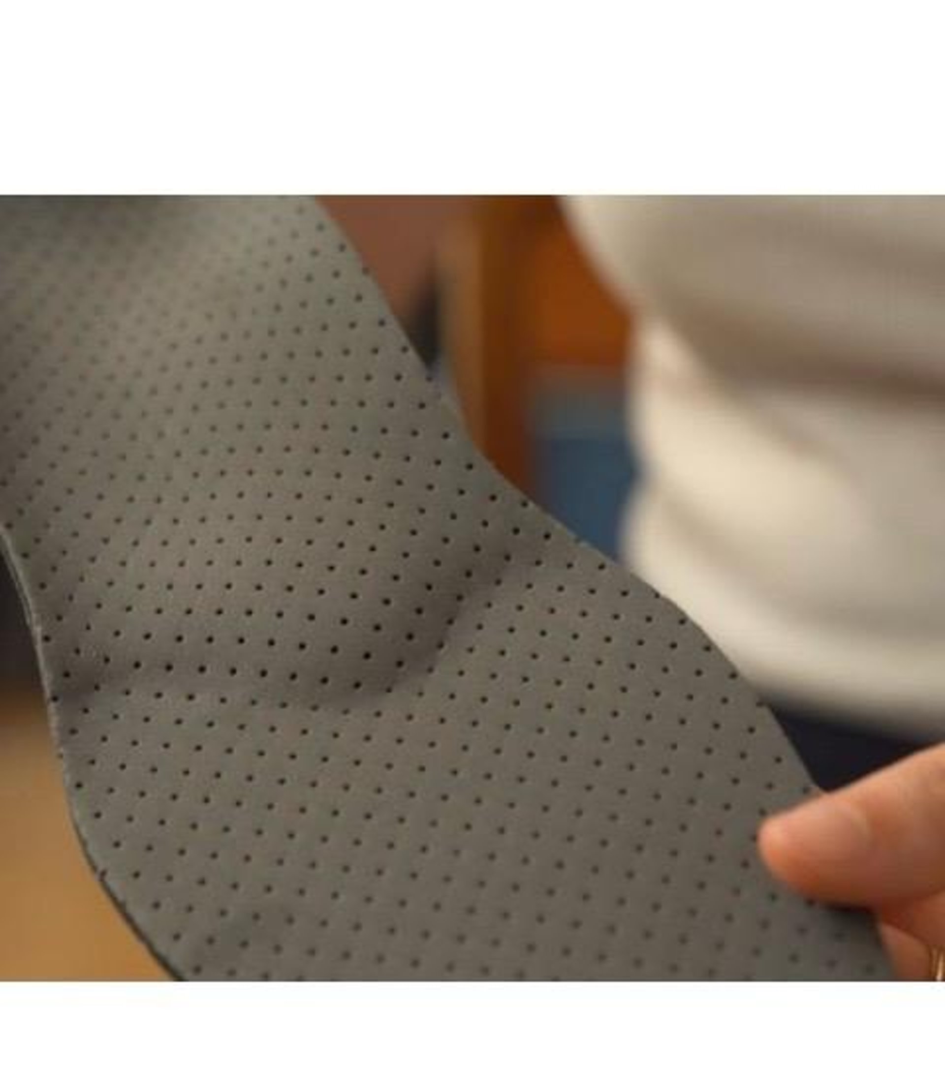 an abstract photo of a curved building with a blue sky in the background