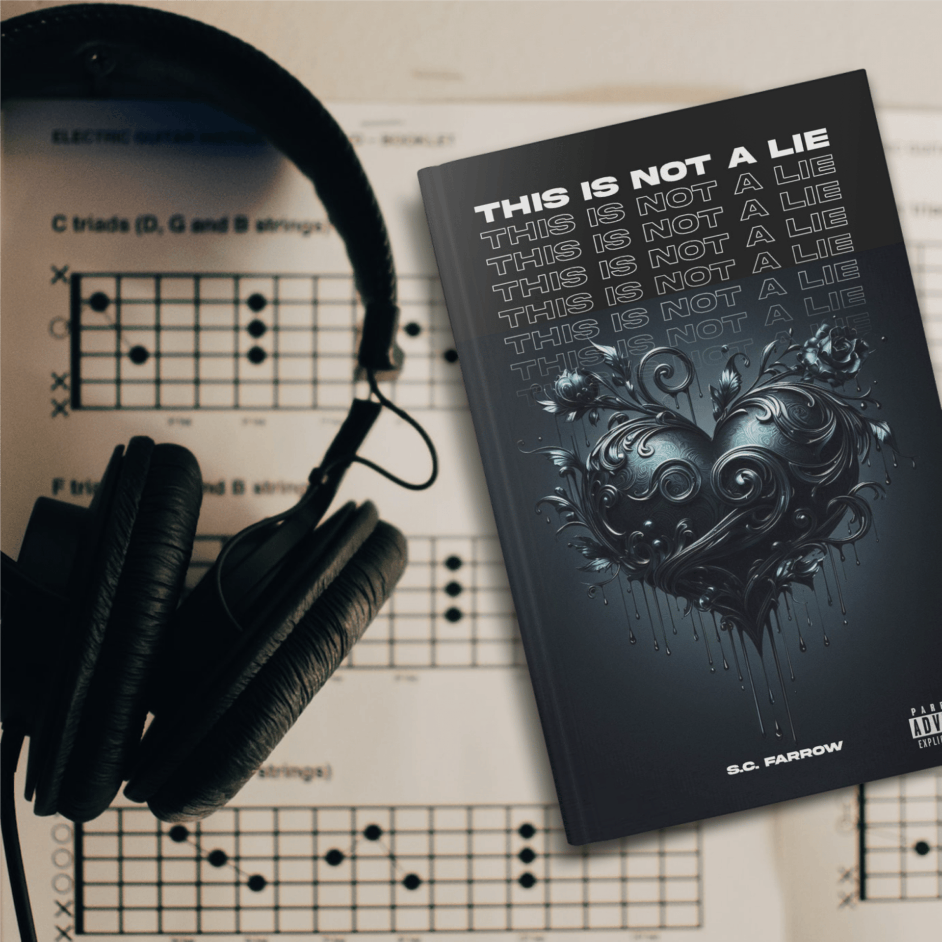 A book with a black cover featuring a black romantic heart lying on a sheet of music next to a pair of headphones