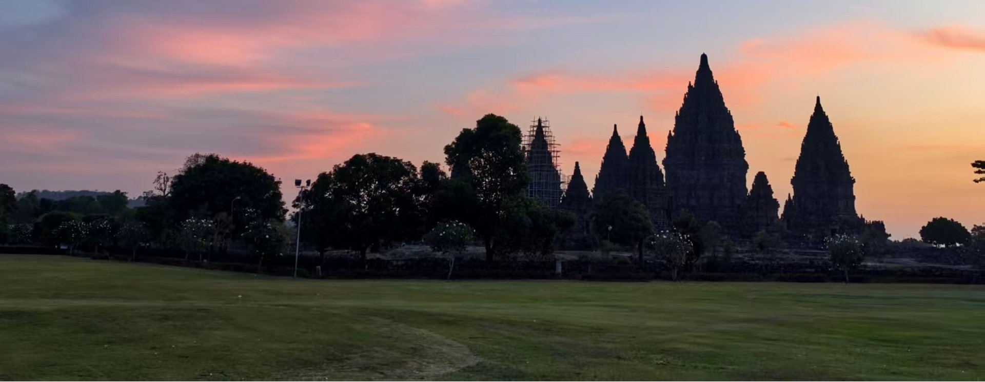 The sun shines brightly through the windows of a building