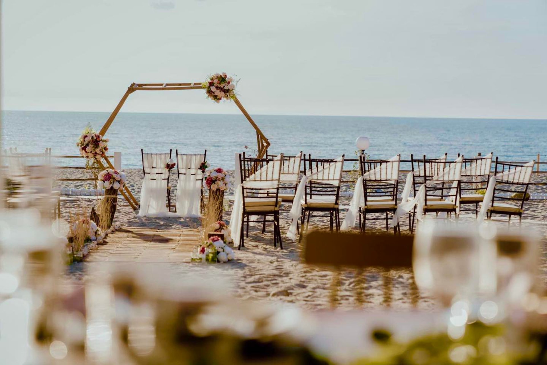 an abstract photo of a curved building with a blue sky in the background