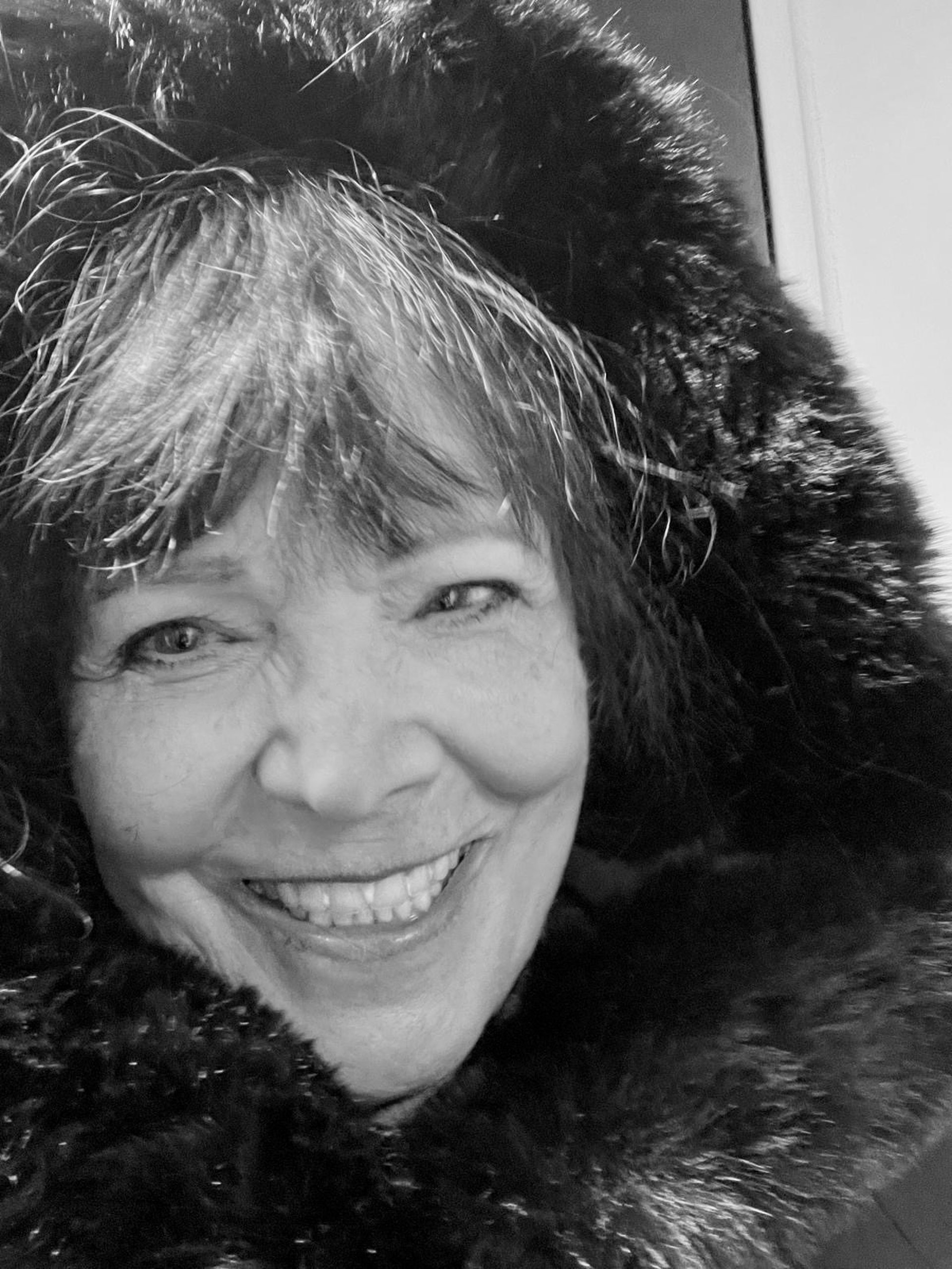 silver and green ring on white surface