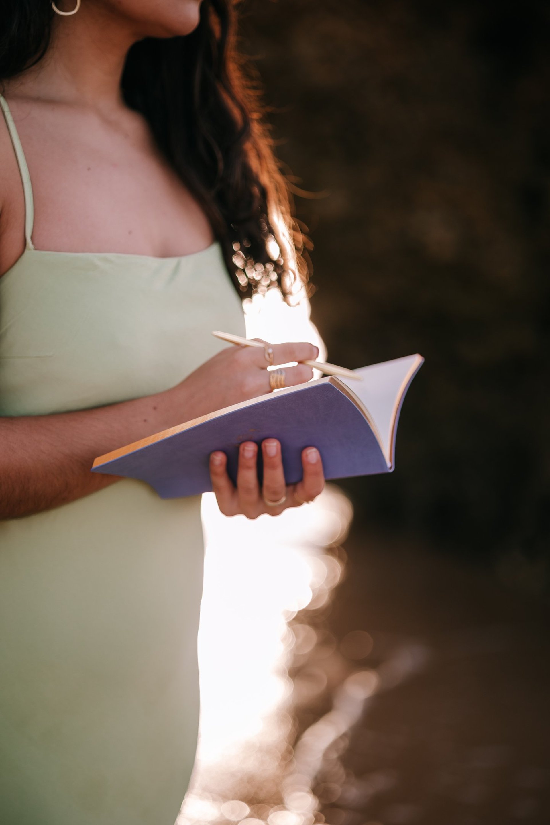 woman wearing yellow long-sleeved dress under white clouds and blue sky during daytime