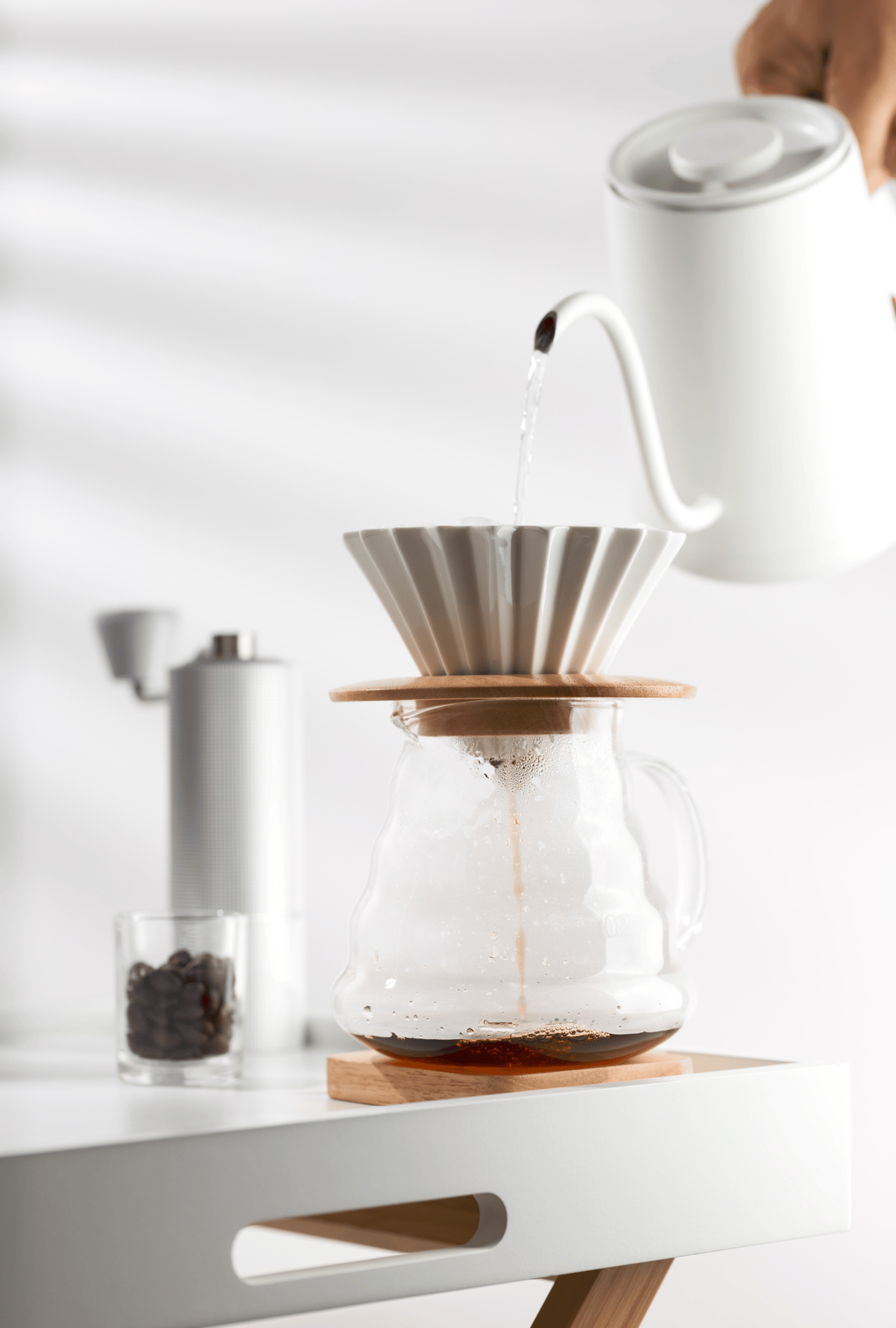 white ceramic mug on white textile