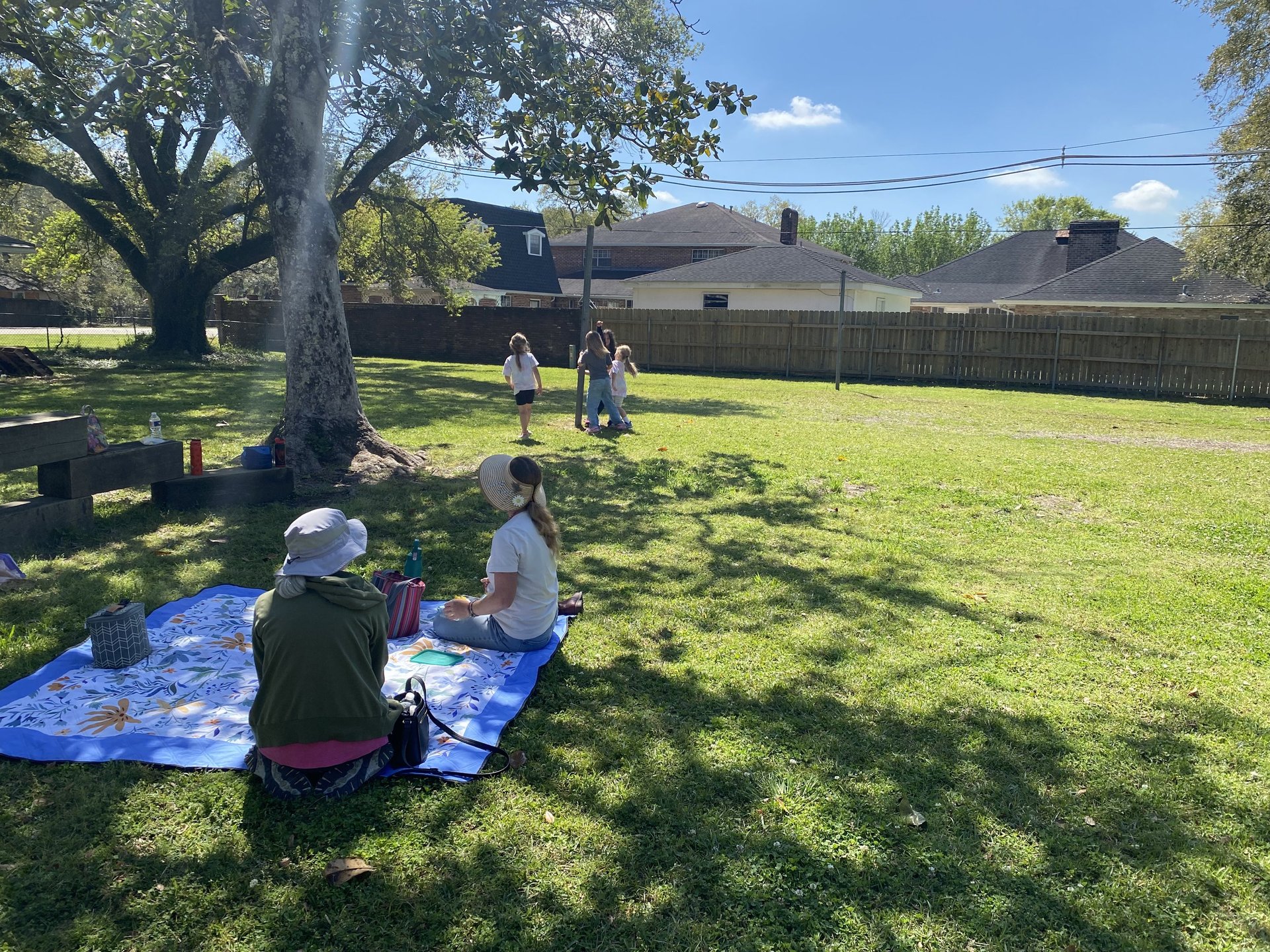 woman wearing yellow long-sleeved dress under white clouds and blue sky during daytime