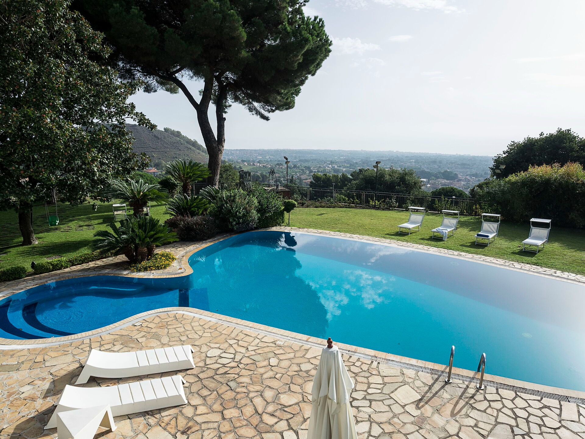 white boat on sea near mountain during daytime