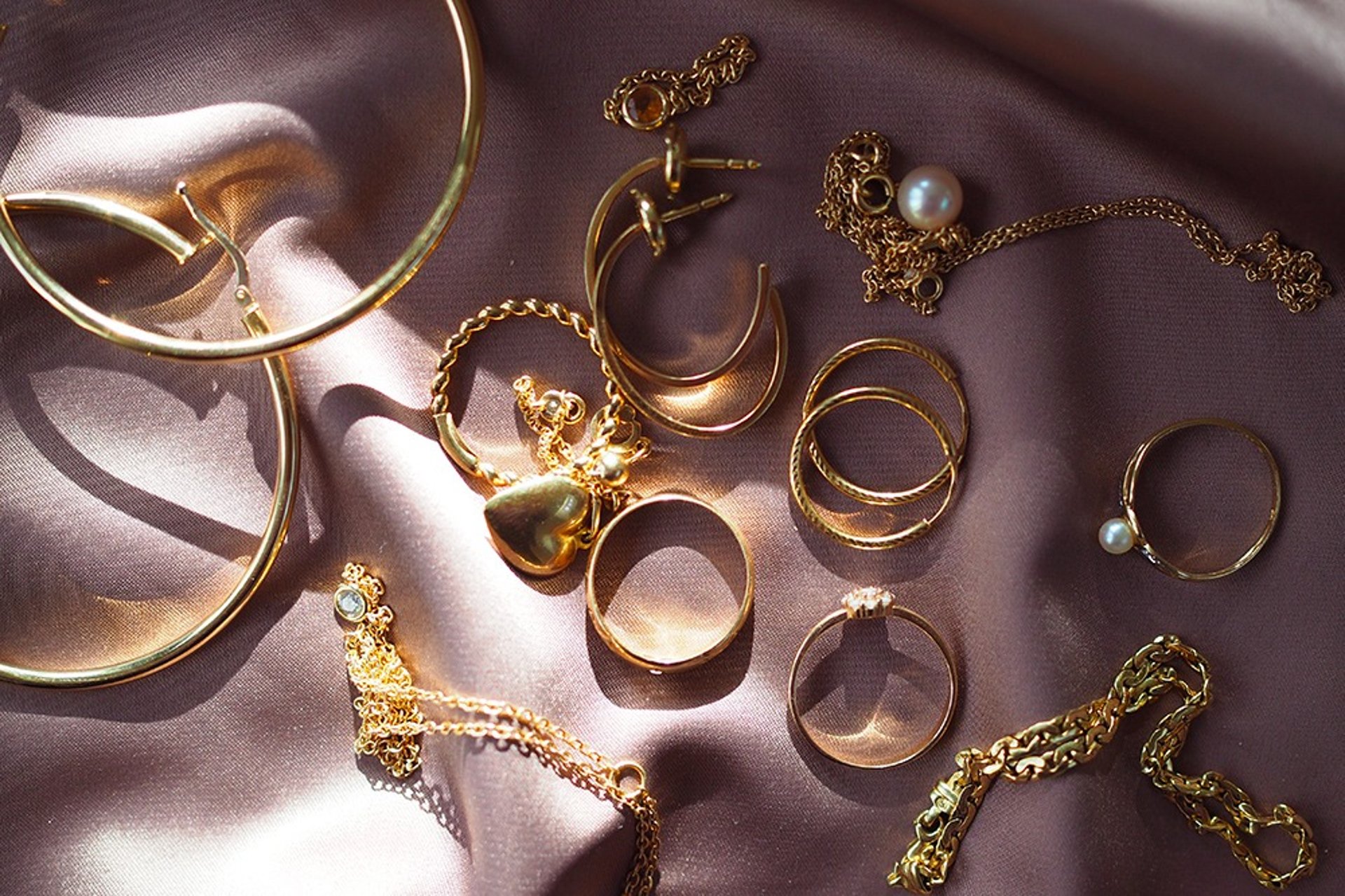 a close up of a gold necklace on a plate