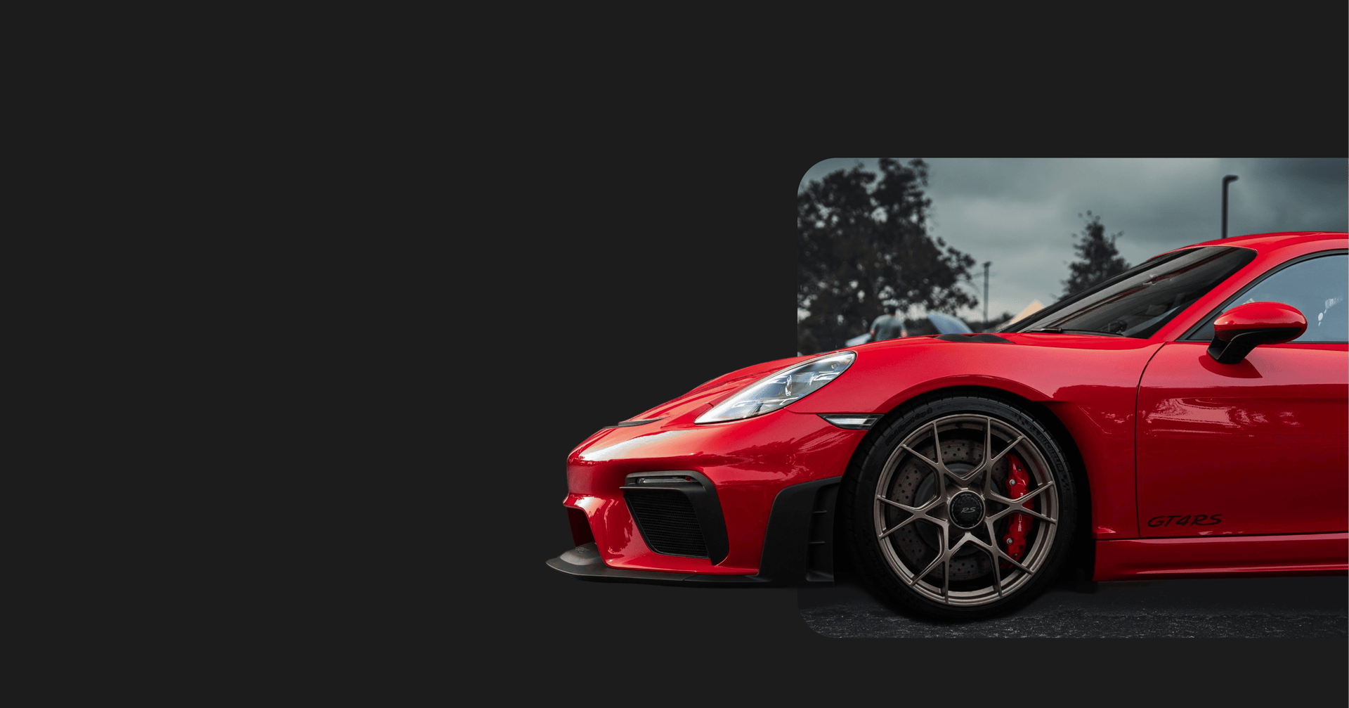 a blue and orange sports car parked in a parking lot