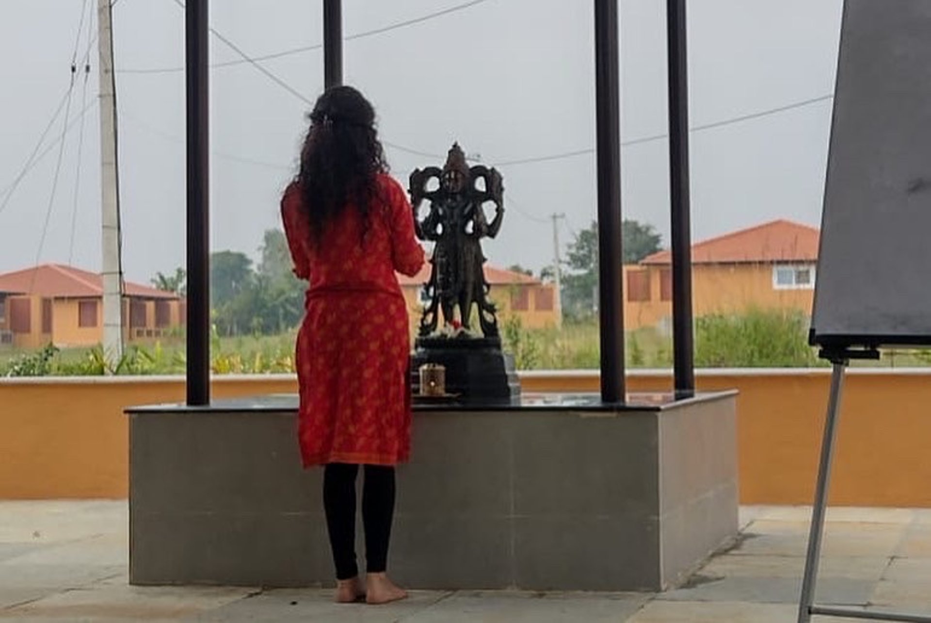 an abstract photo of a curved building with a blue sky in the background