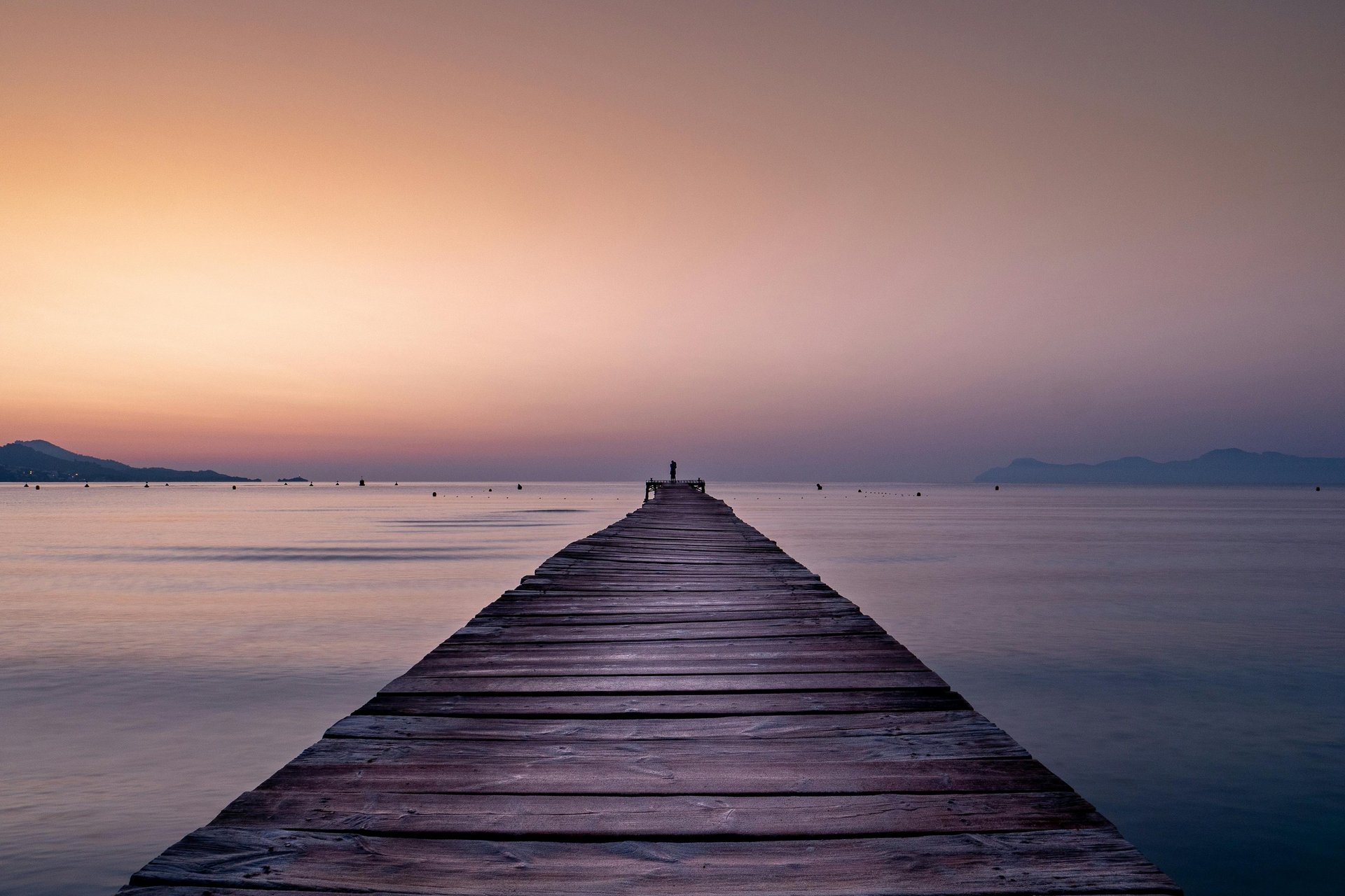 an abstract photo of a curved building with a blue sky in the background