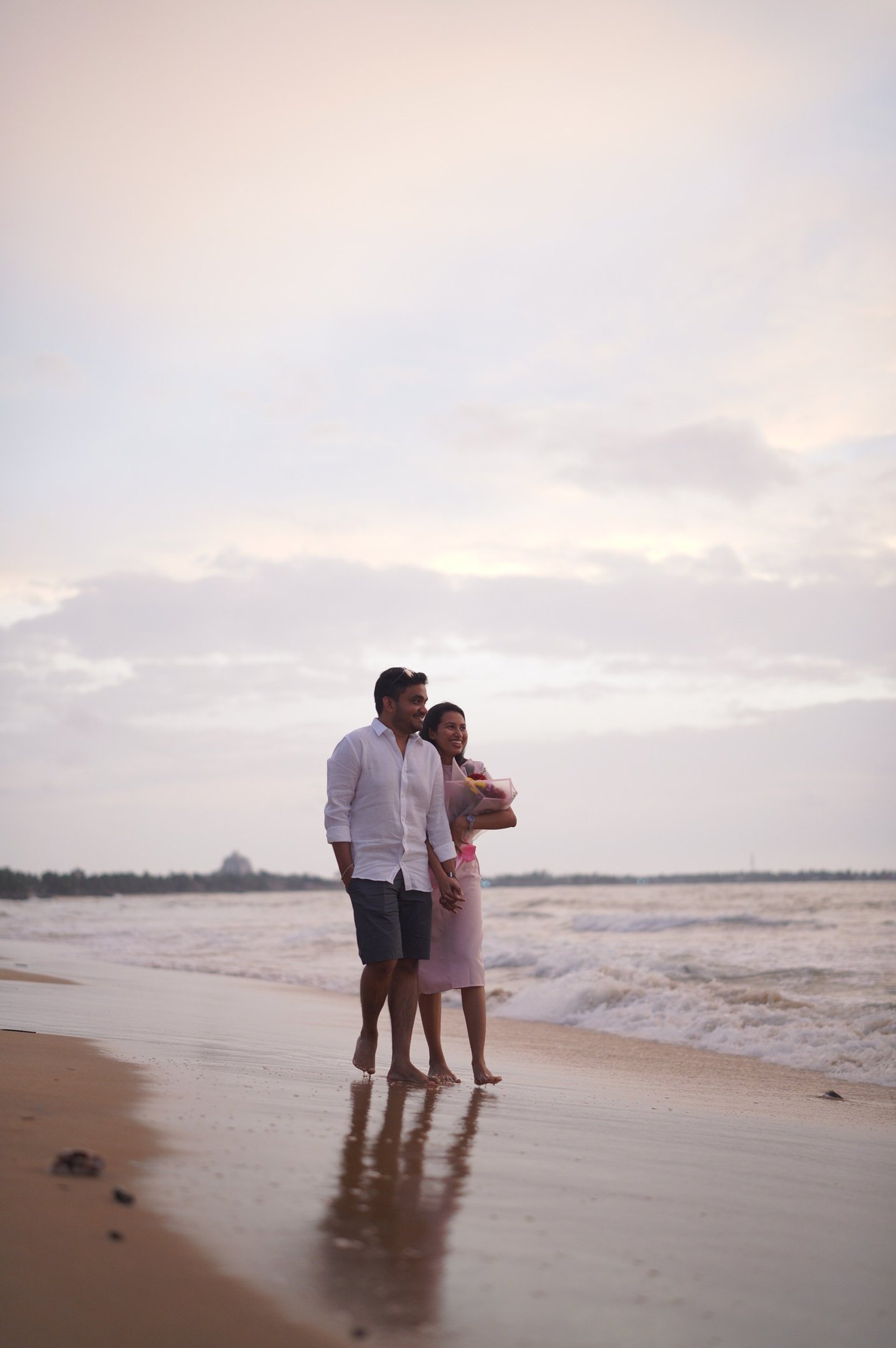 couple wearing silver-colored rings