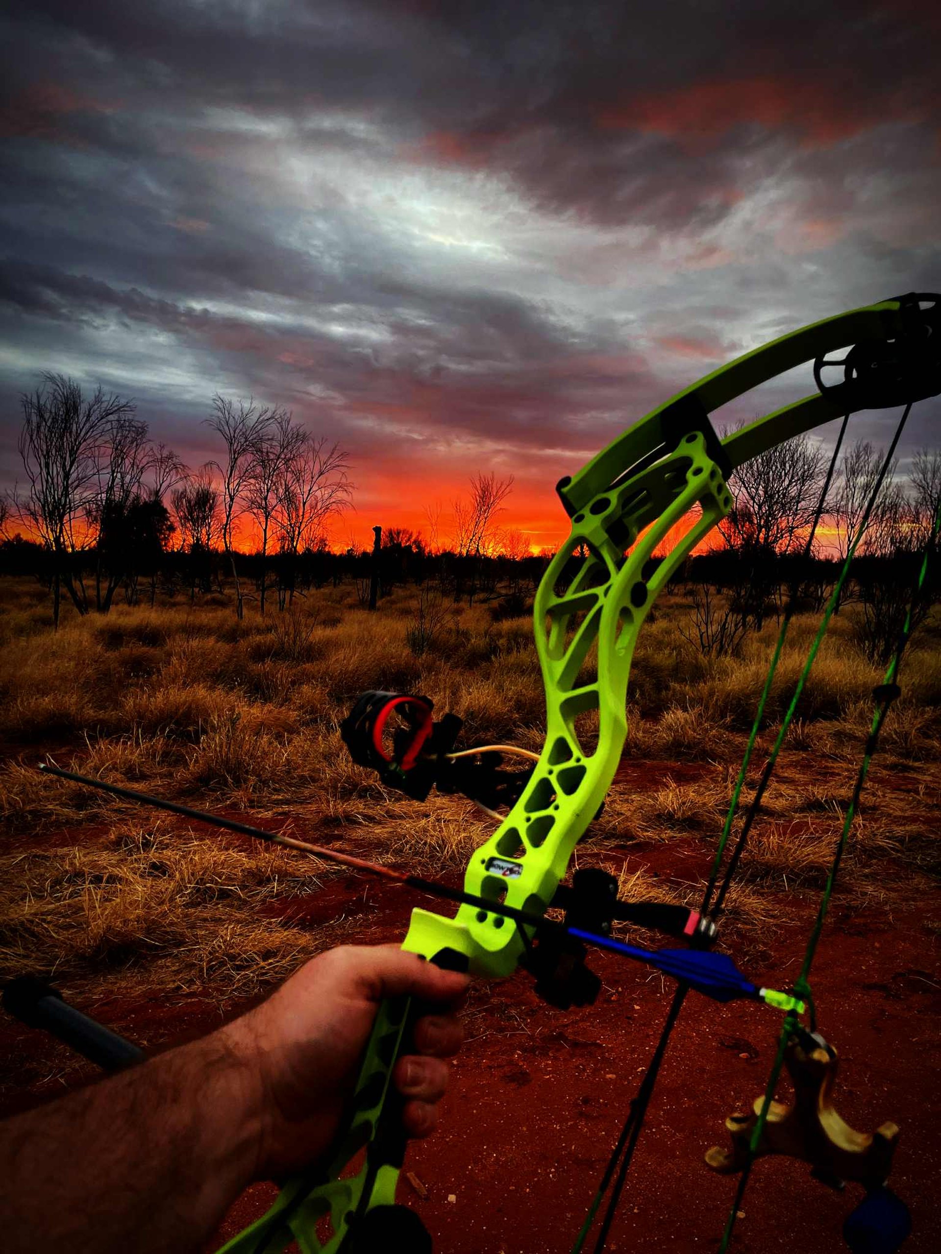 man holding composite bow
