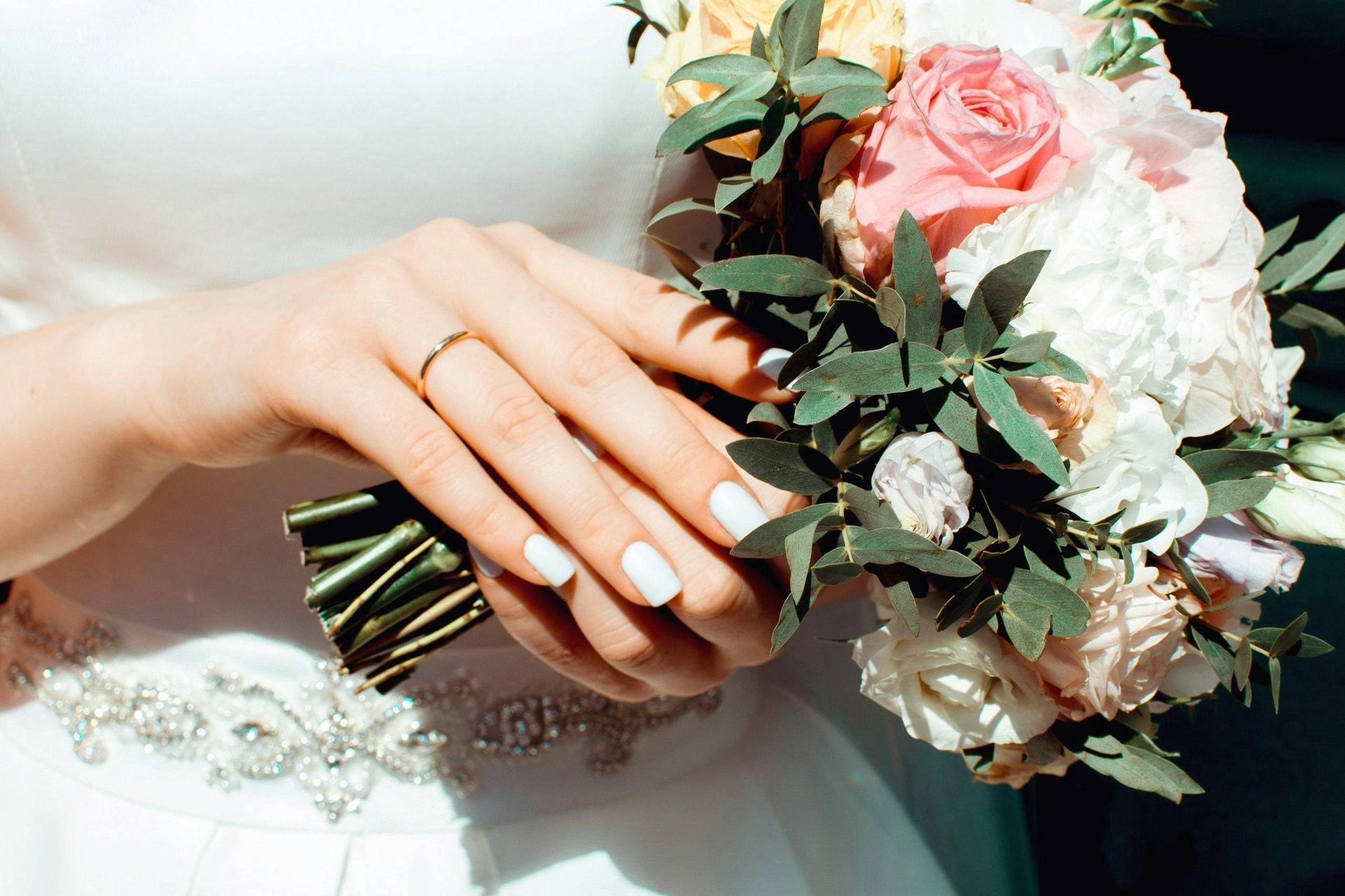 couple wearing silver-colored rings
