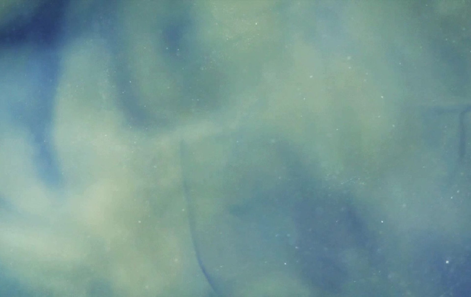 a blurry image of a white and blue light