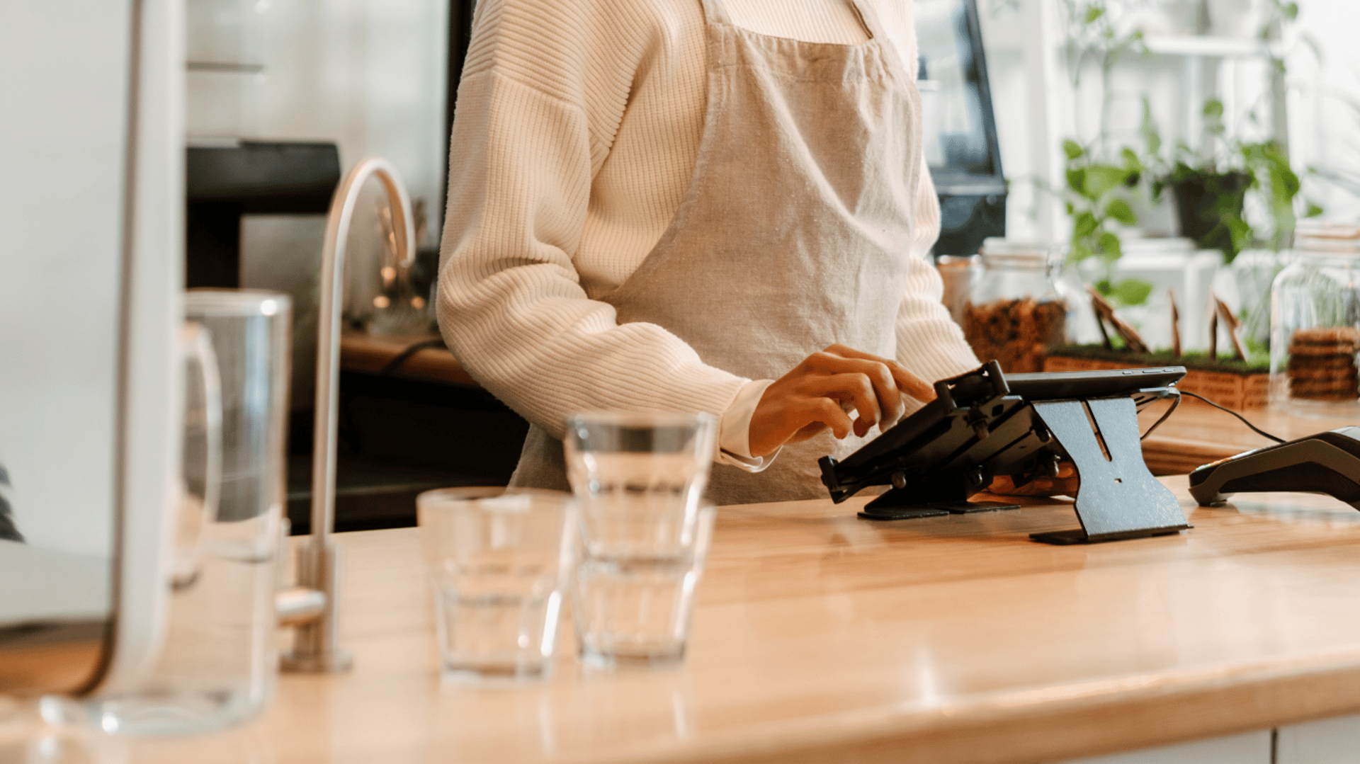 Customer pays at a coffee shop.