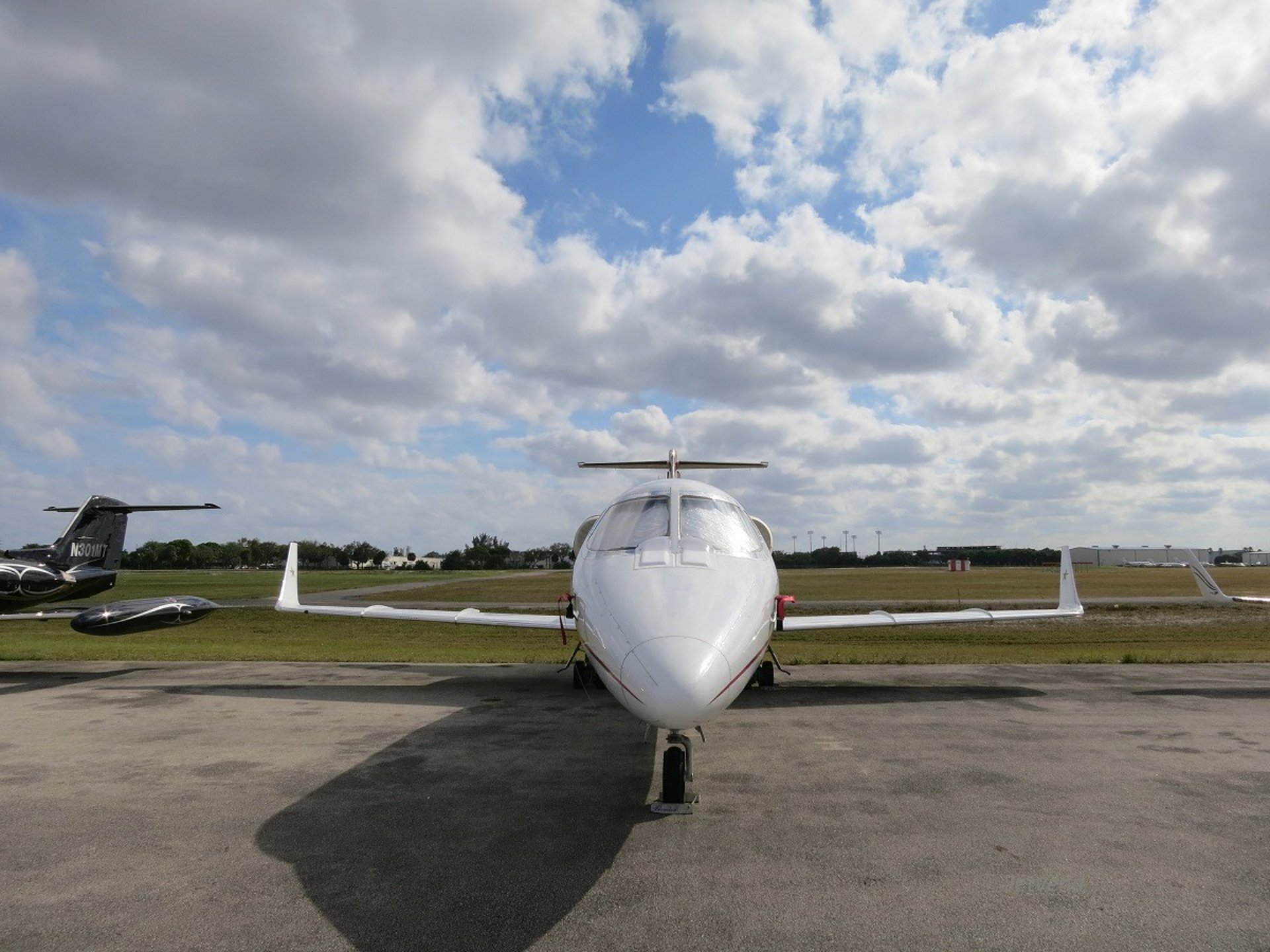 a small plane is flying low to the ground